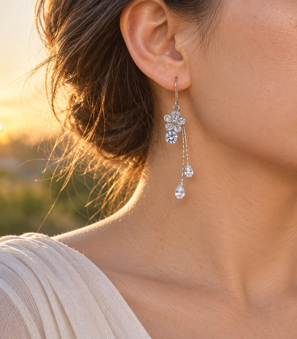 JIMIKI Silver Tone Crystal Flower Teardrop Tassel Earring Pair in Silver tone, editorial model view