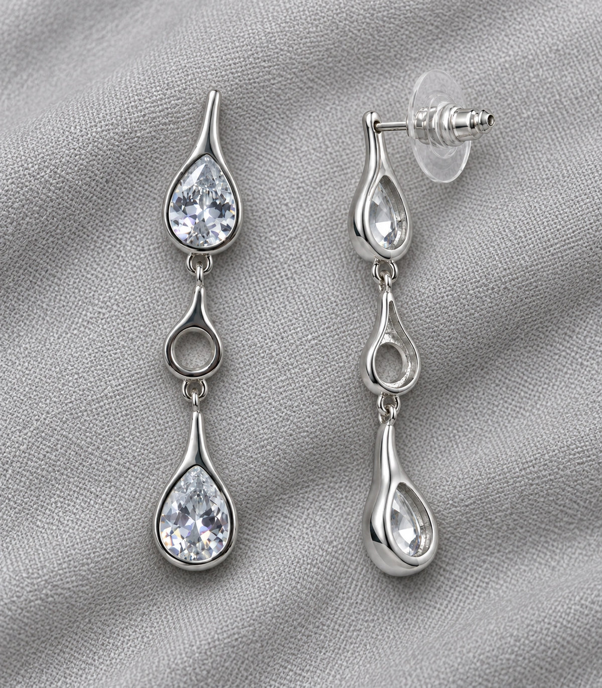 JIMIKI Crystal Teardrop Open Link Drop Earring Pair in Silver tone, editorial flat lay #color_silver tone