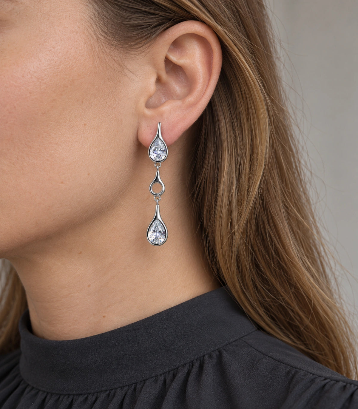 JIMIKI Crystal Teardrop Open Link Drop Earring Pair in Silver tone, model wearing view #color_silver tone