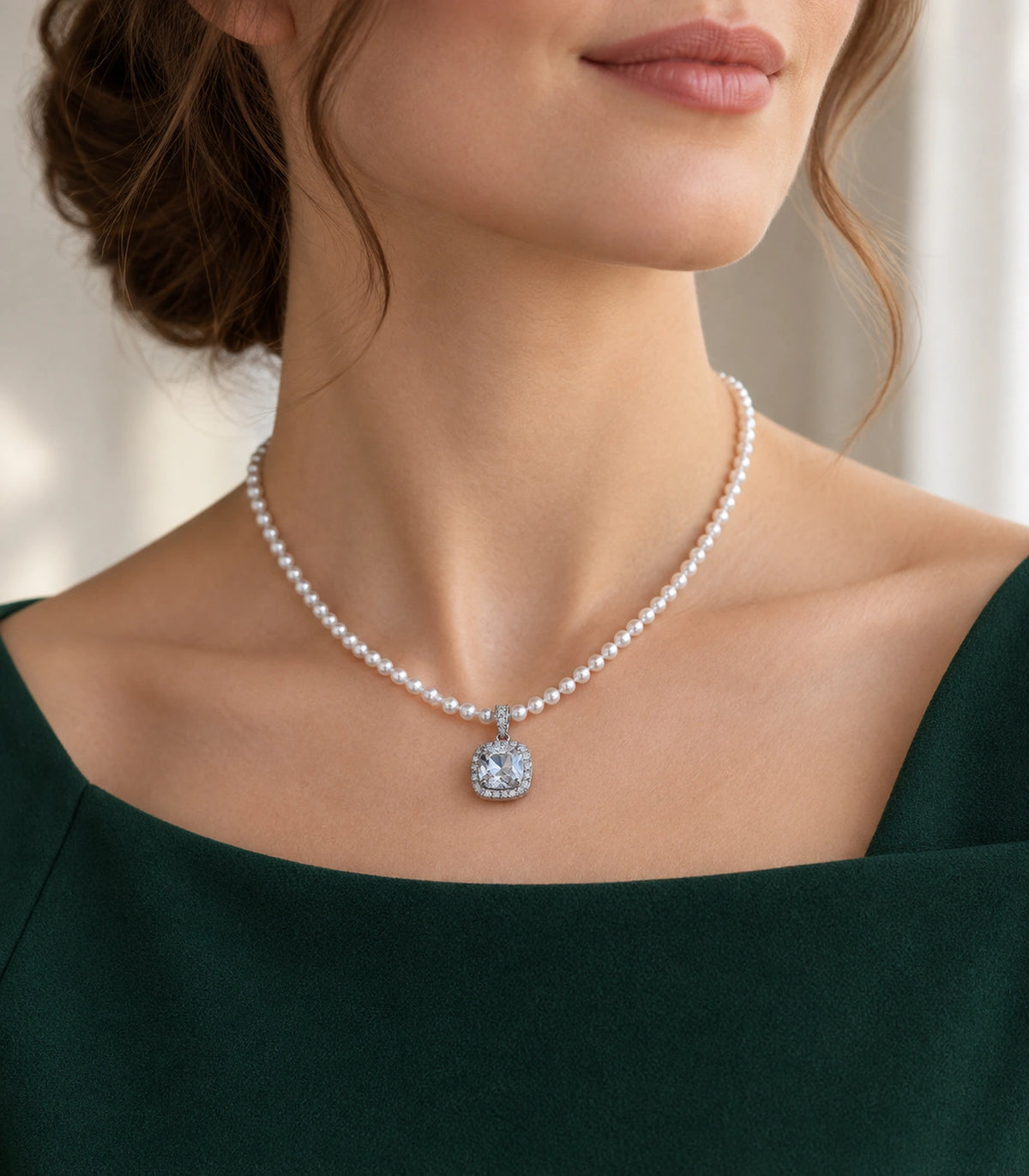 JIMIKI Silver-Tone Cushion Crystal Halo Pearl Necklace in Silver-tone / clear / white, styled on a model in an editorial setting