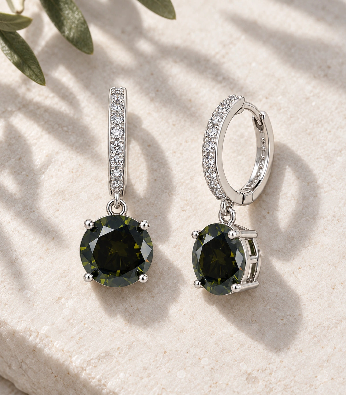 JIMIKI Round Crystal Hoop Drop Earring Pair in Silver tone / dark green, editorial flat lay #color_silver tone / dark green