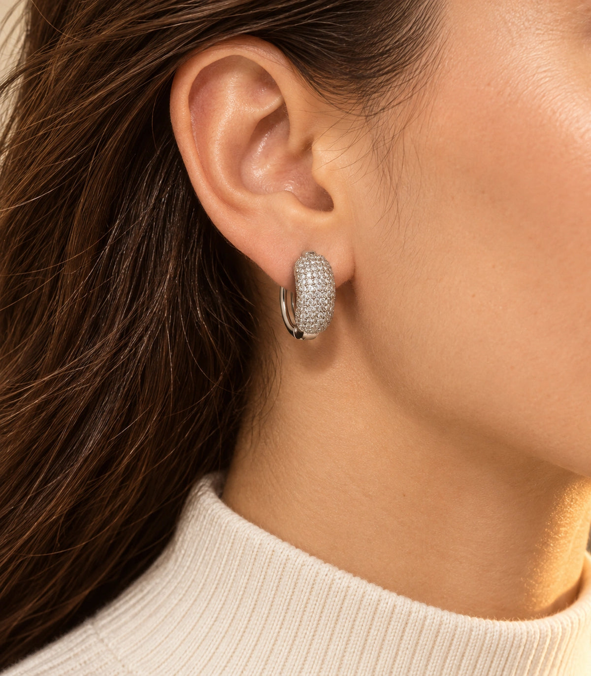 JIMIKI Silver-Tone Domed Pave Hinged Hoop Earring Pair in Silver Tone, editorial model view