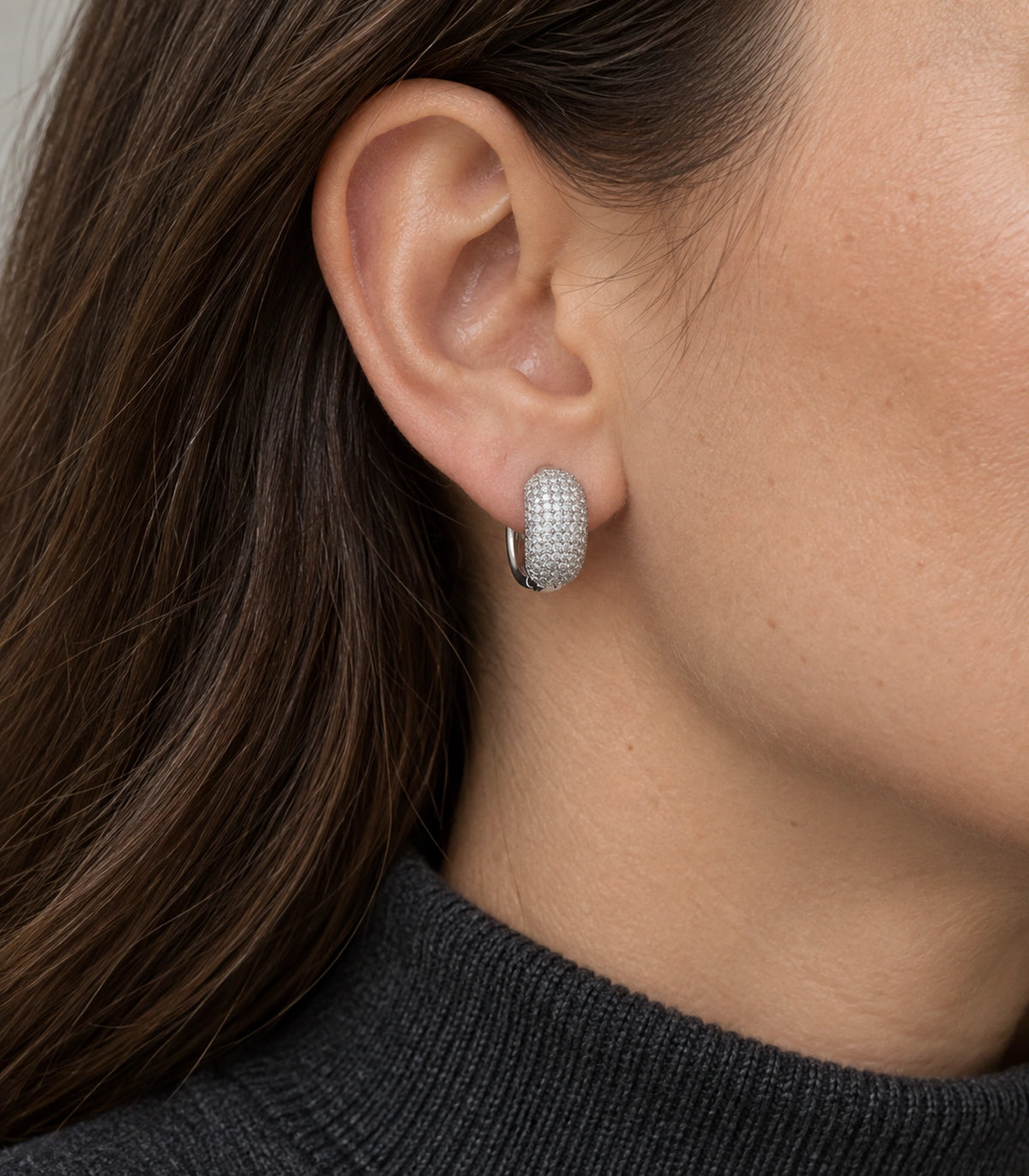JIMIKI Silver-Tone Domed Pave Hinged Hoop Earring Pair in Silver Tone, model wearing view