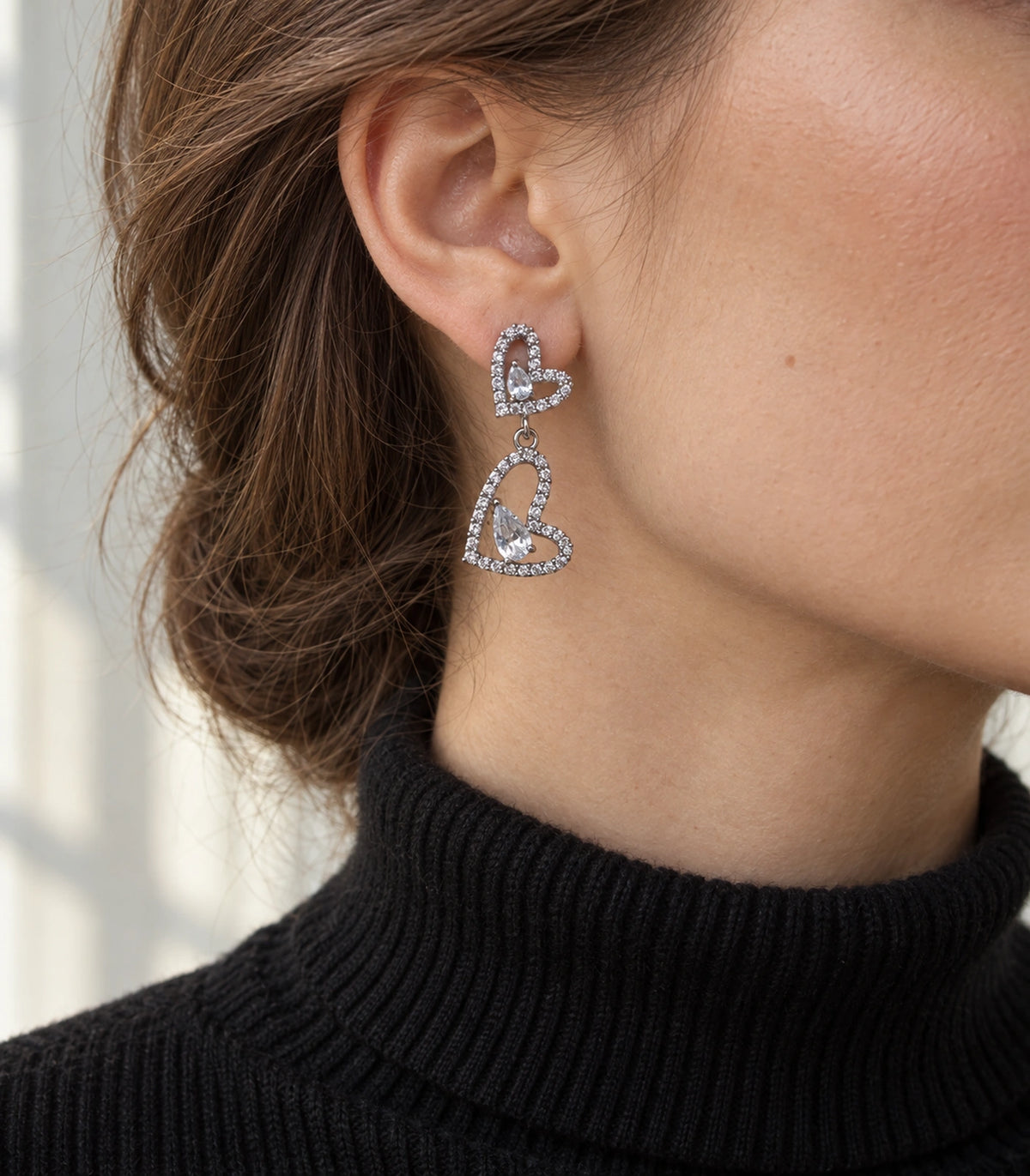 JIMIKI Double Heart Pear Crystal Drop Earrings in Silver Tone, editorial model view #color_silver tone