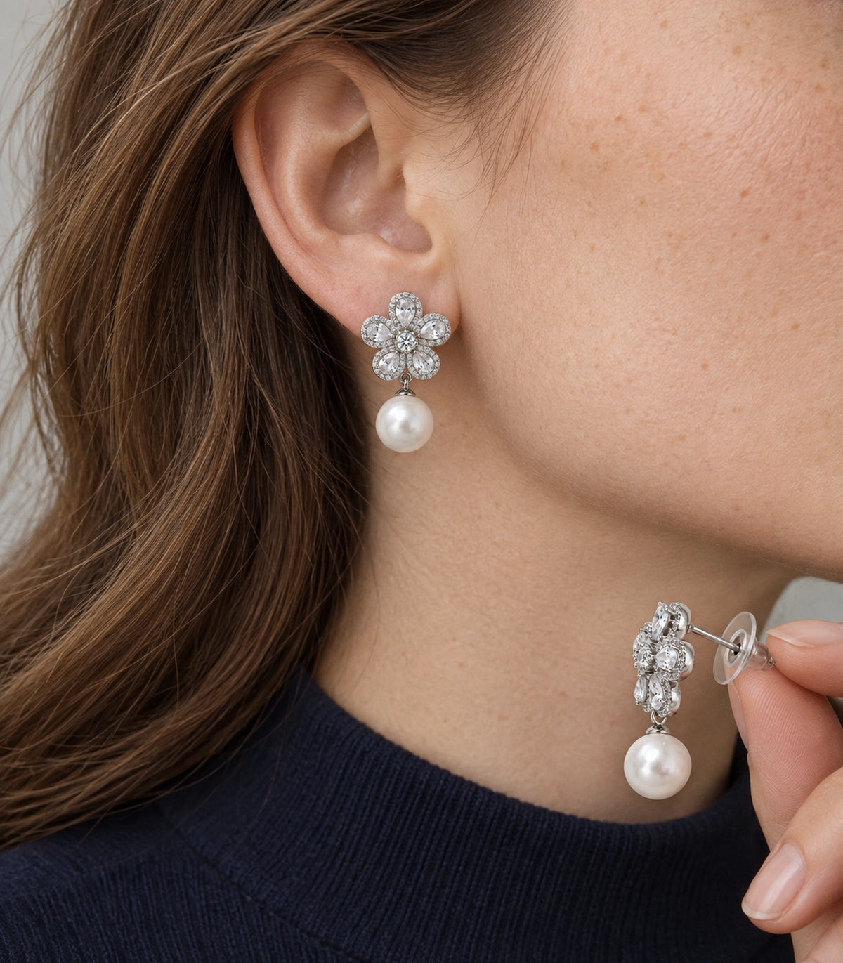 JIMIKI Five Petal Crystal Flower Pearl Drop Earring Pair in Silver-tone, model wearing view #color_silver-tone