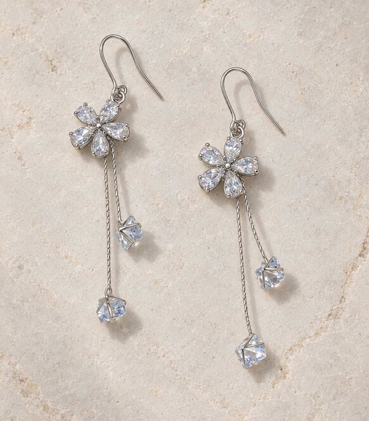 JIMIKI Silver Tone Flower Twin Cube Crystal Drop Earring Pair in Silver-tone, editorial flat lay