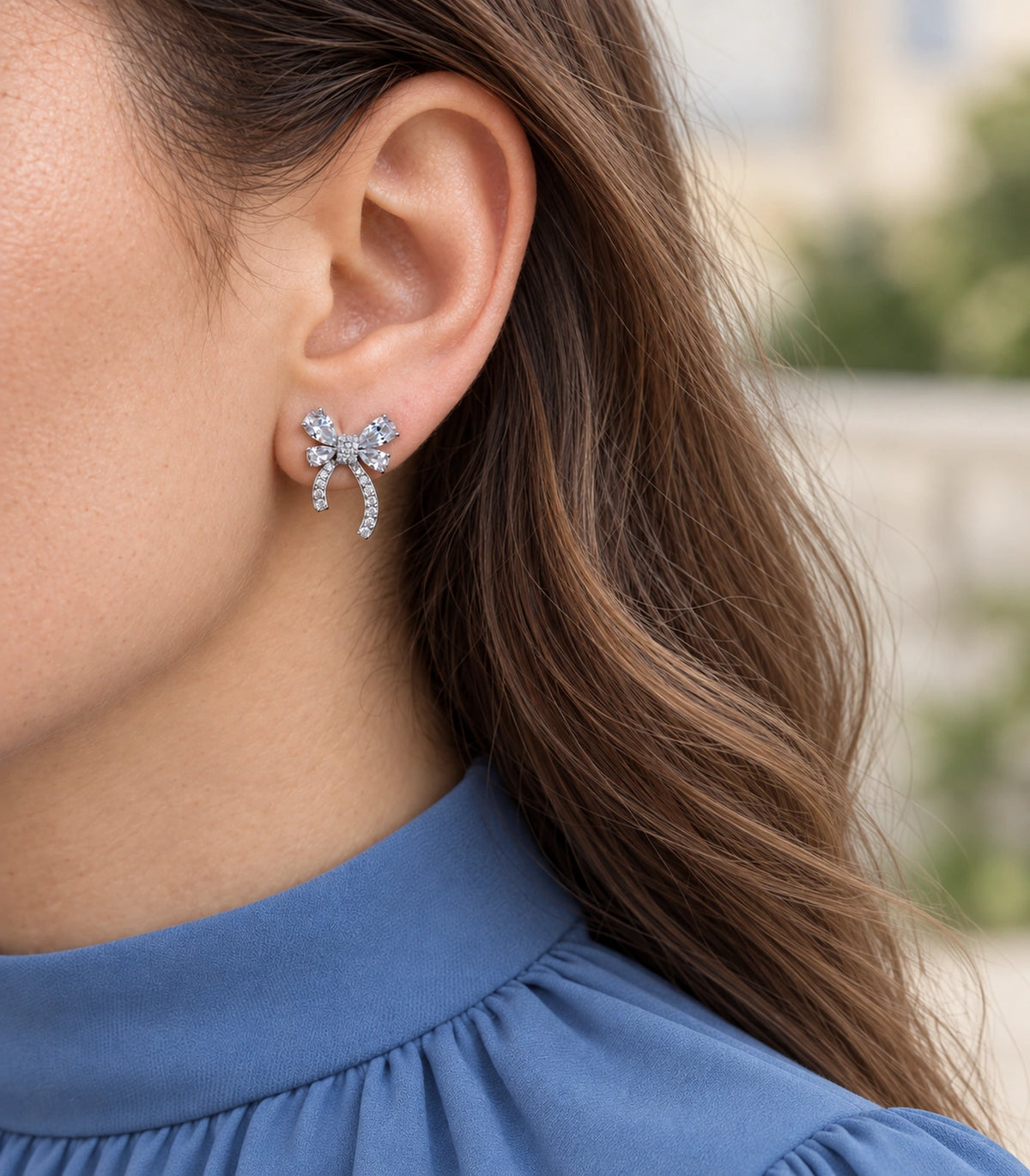 JIMIKI Four Pear Crystal Bow Stud Earring Pair in Silver Tone, close-up detail #color_silver tone