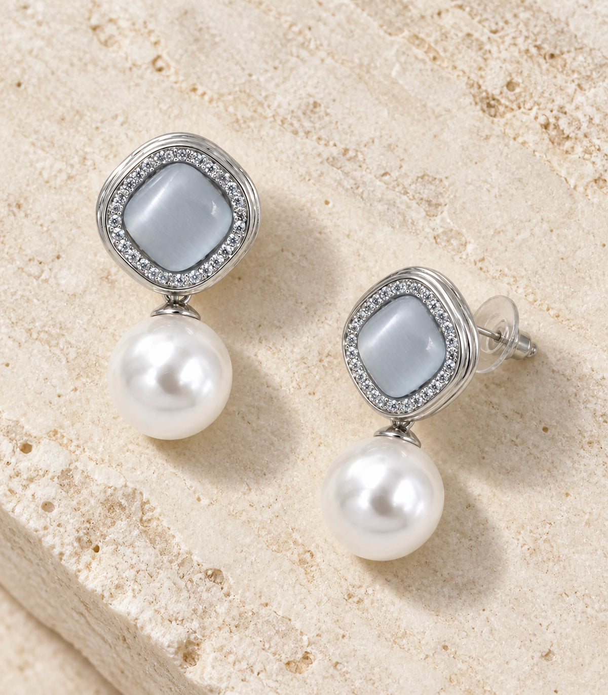 JIMIKI Crystal Halo Pearl Drop Earring Pair in Silver-tone / Grey, editorial flat lay #color_silver-tone / grey
