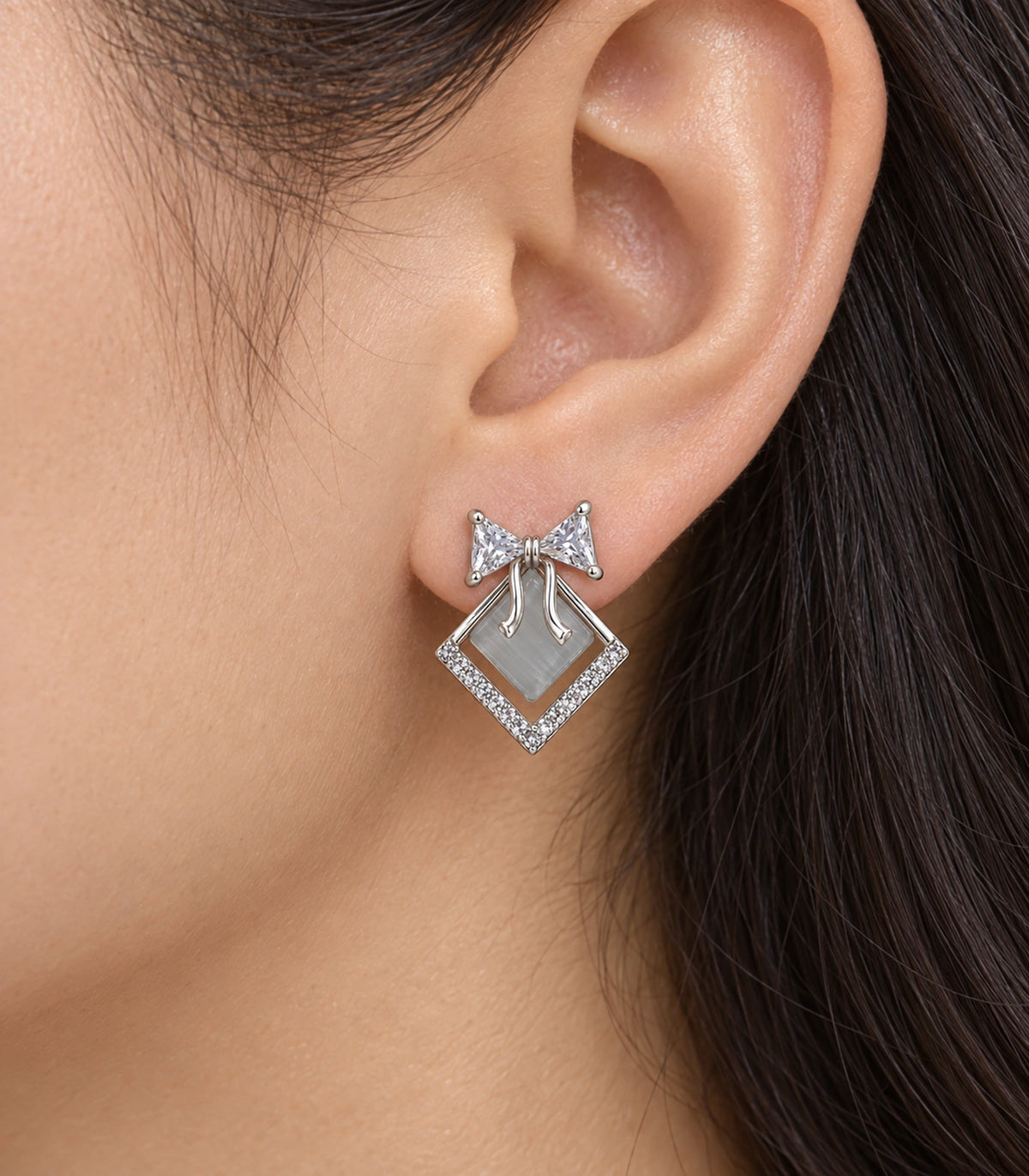 JIMIKI Silver Tone Grey Diamond-Shaped Bow Crystal Stud Earring Pair in Silver tone, close-up detail