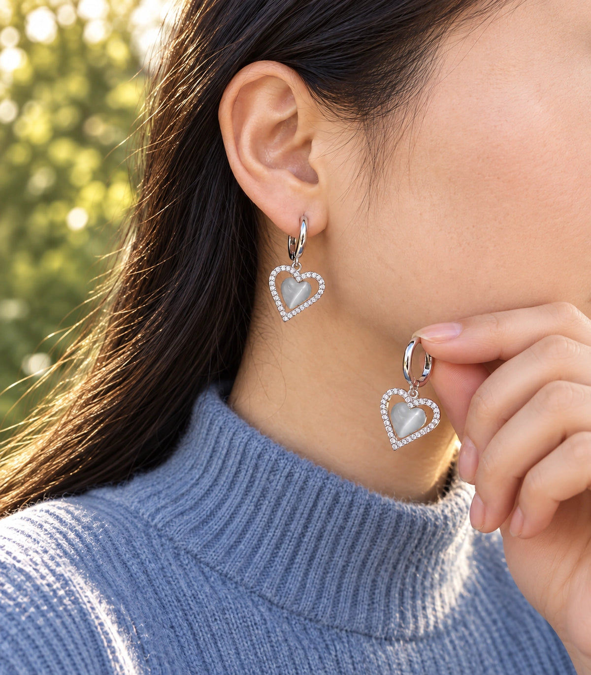 JIMIKI Heart Crystal Frame Drop Hoop Earring Pair in Silver-tone / Grey, editorial model view #color_silver-tone / grey