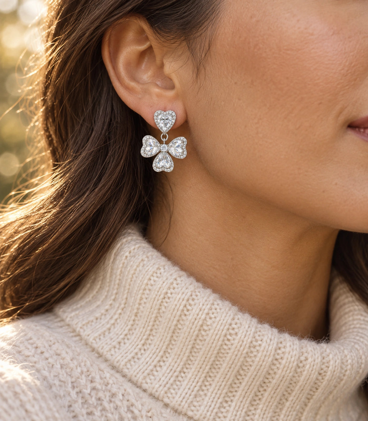JIMIKI Heart Crystal Three Petal Drop Earring Pair in Silver-tone, editorial model view #color_silver-tone