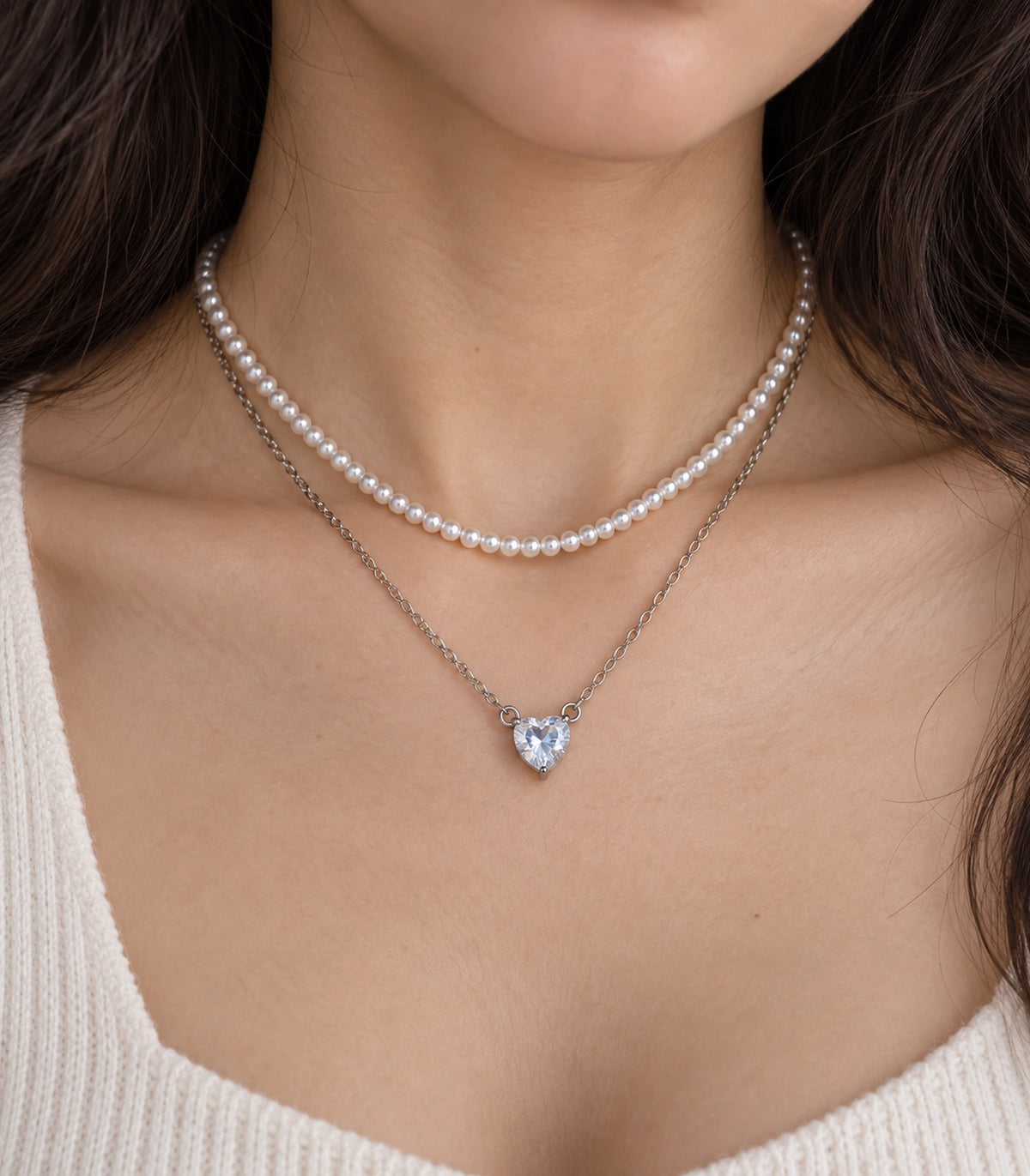 JIMIKI Silver-Tone Heart Layered Pearl Necklace Set in Silver-tone / clear / white, close-up of the pendant and pearl-style strand