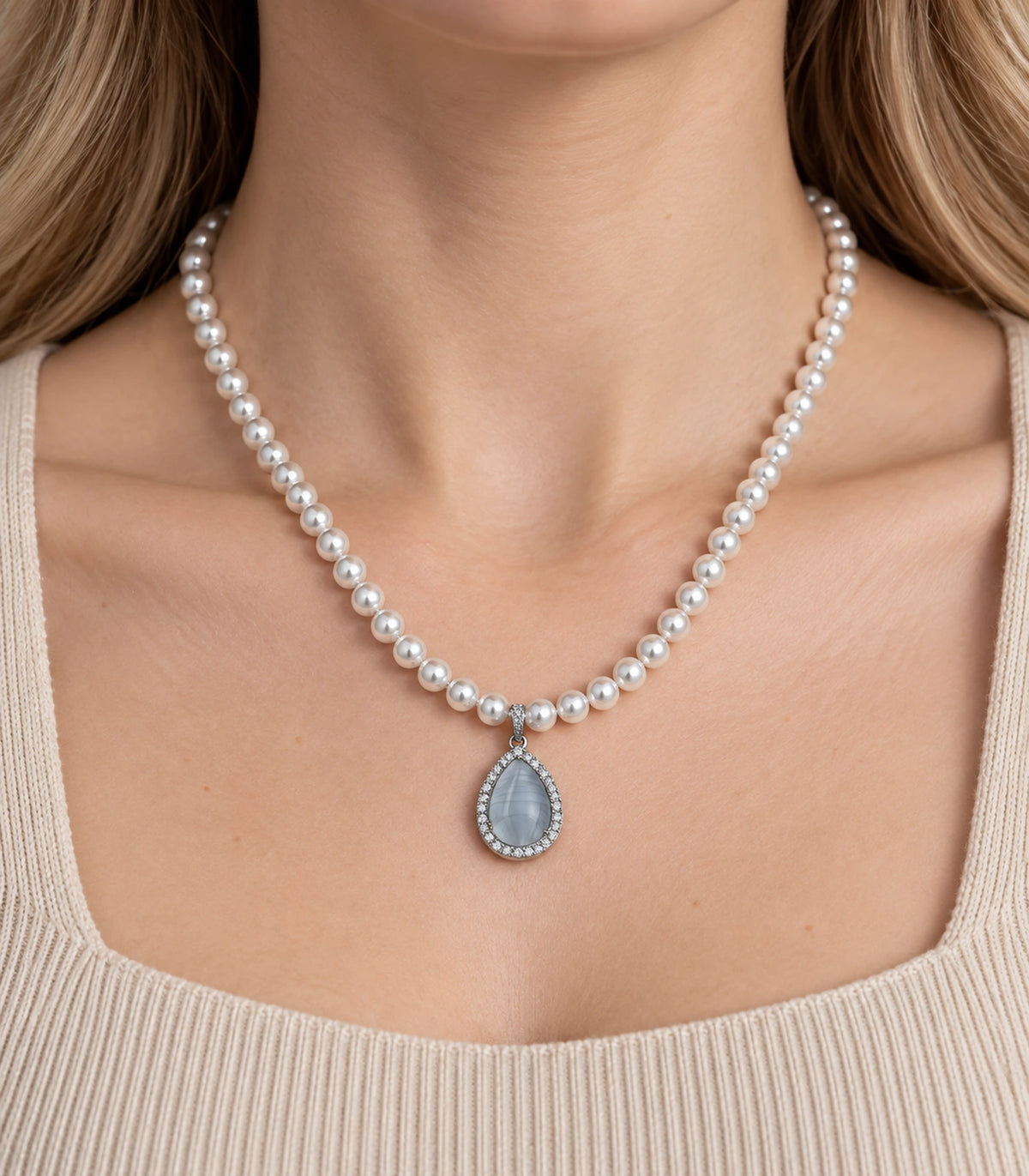 JIMIKI Silver-Tone Icy Blue Teardrop Pearl Necklace in Silver-tone / icy blue, close-up of the pendant and pearl-style strand