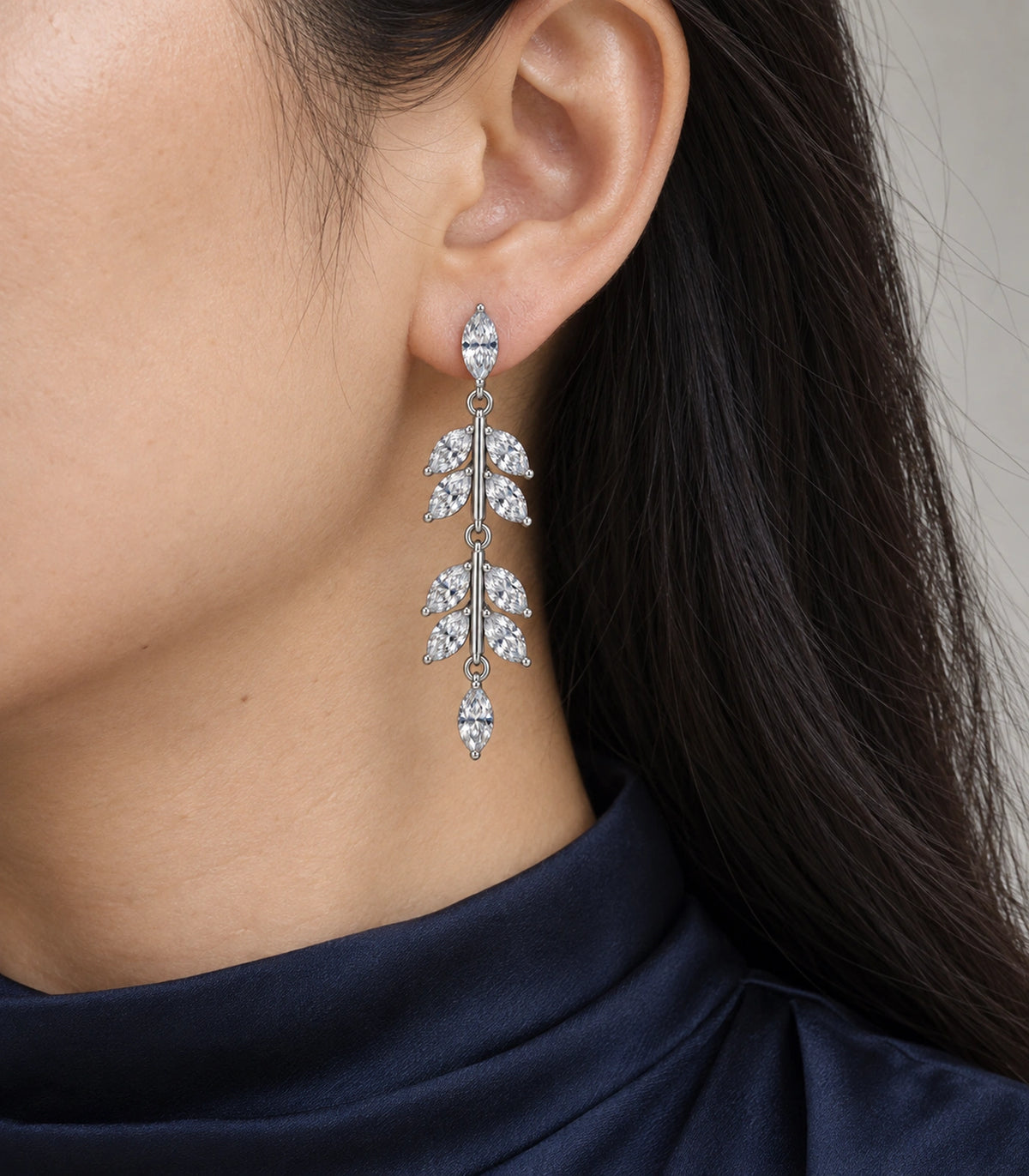 JIMIKI Marquise Crystal Leaf Drop Earring Pair in Silver tone, model wearing view #color_silver tone