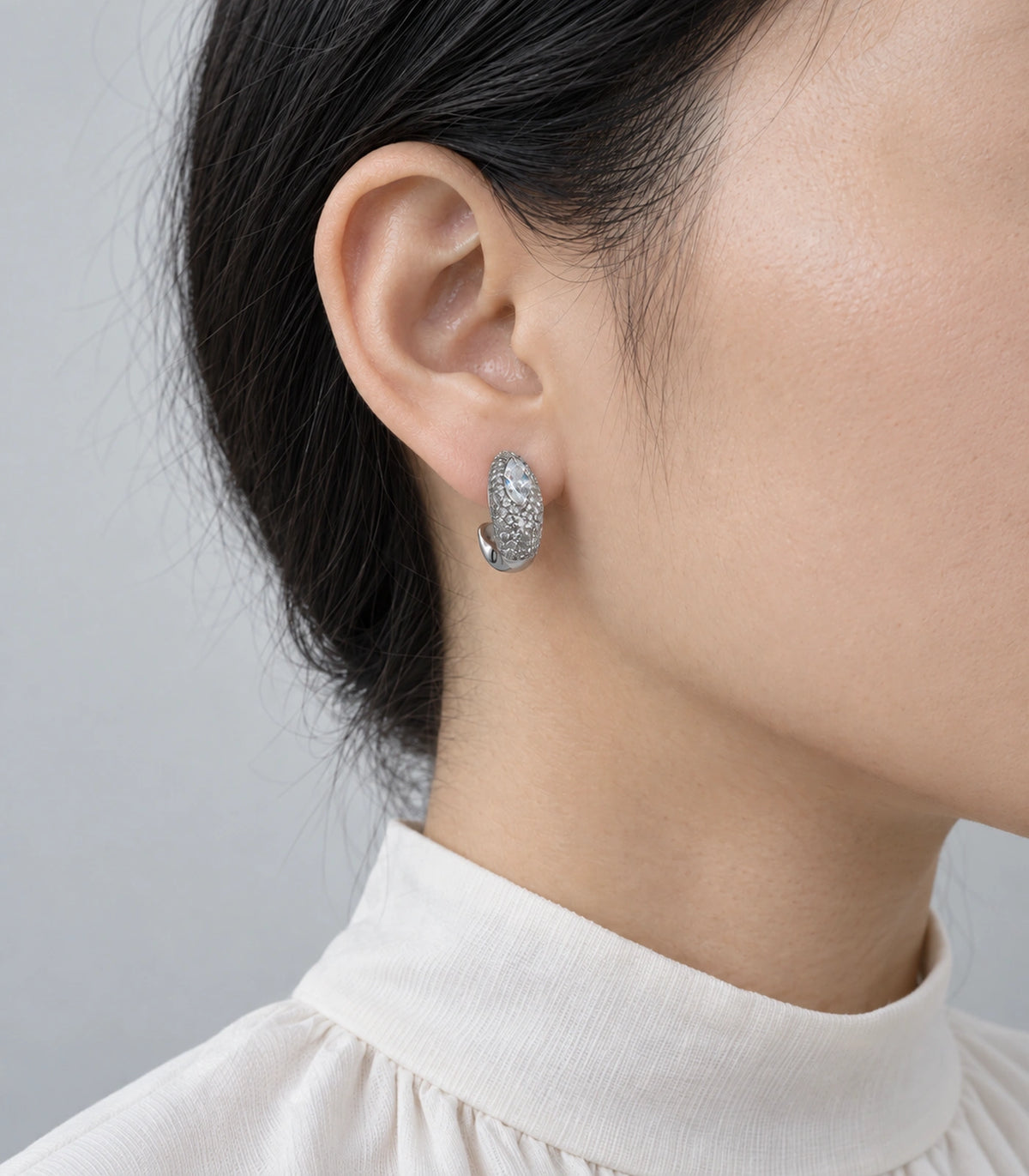 JIMIKI marquise pave open hoop earring pair in silver tone worn on a model #color_silver tone