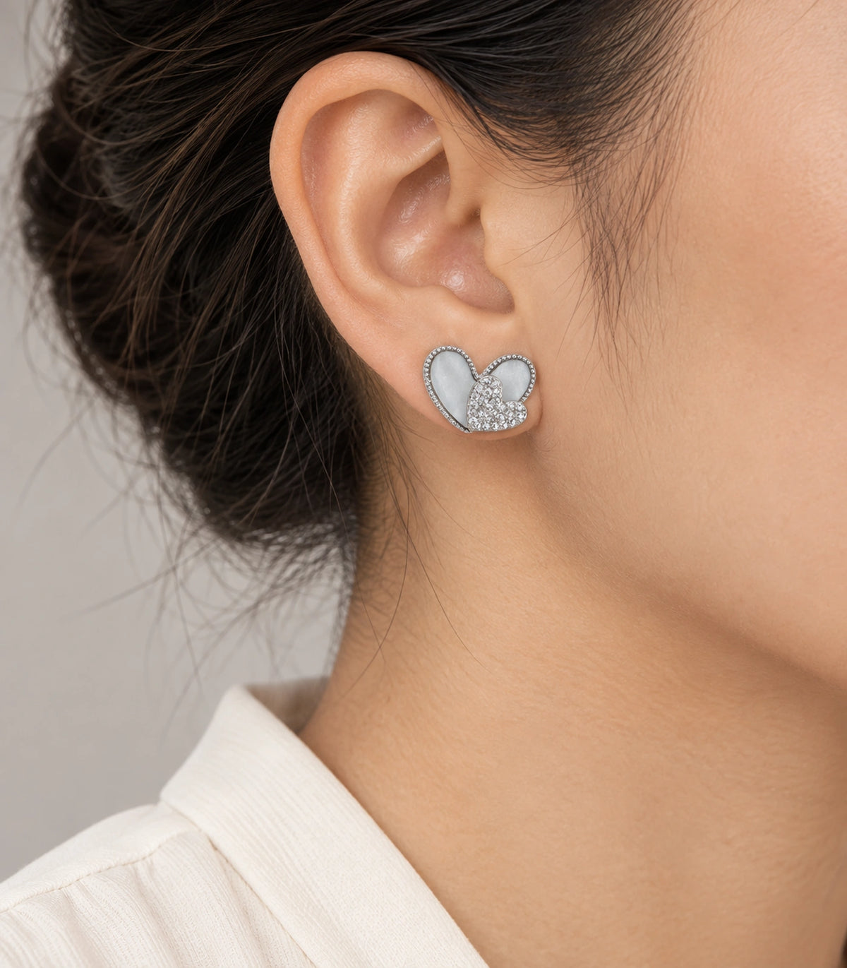 JIMIKI Open Heart Pave Heart Stud Earring Pair in Silver tone, model wearing view #color_silver tone