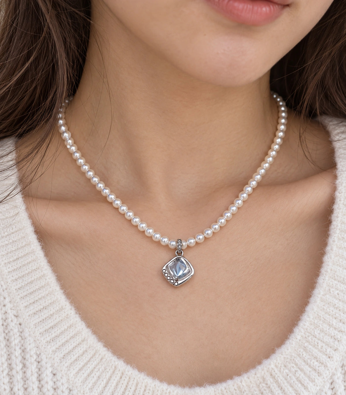 JIMIKI Silver-Tone Organic Cushion Crystal Pearl Necklace in Silver-tone / clear / white, close-up of the pendant and pearl-style strand