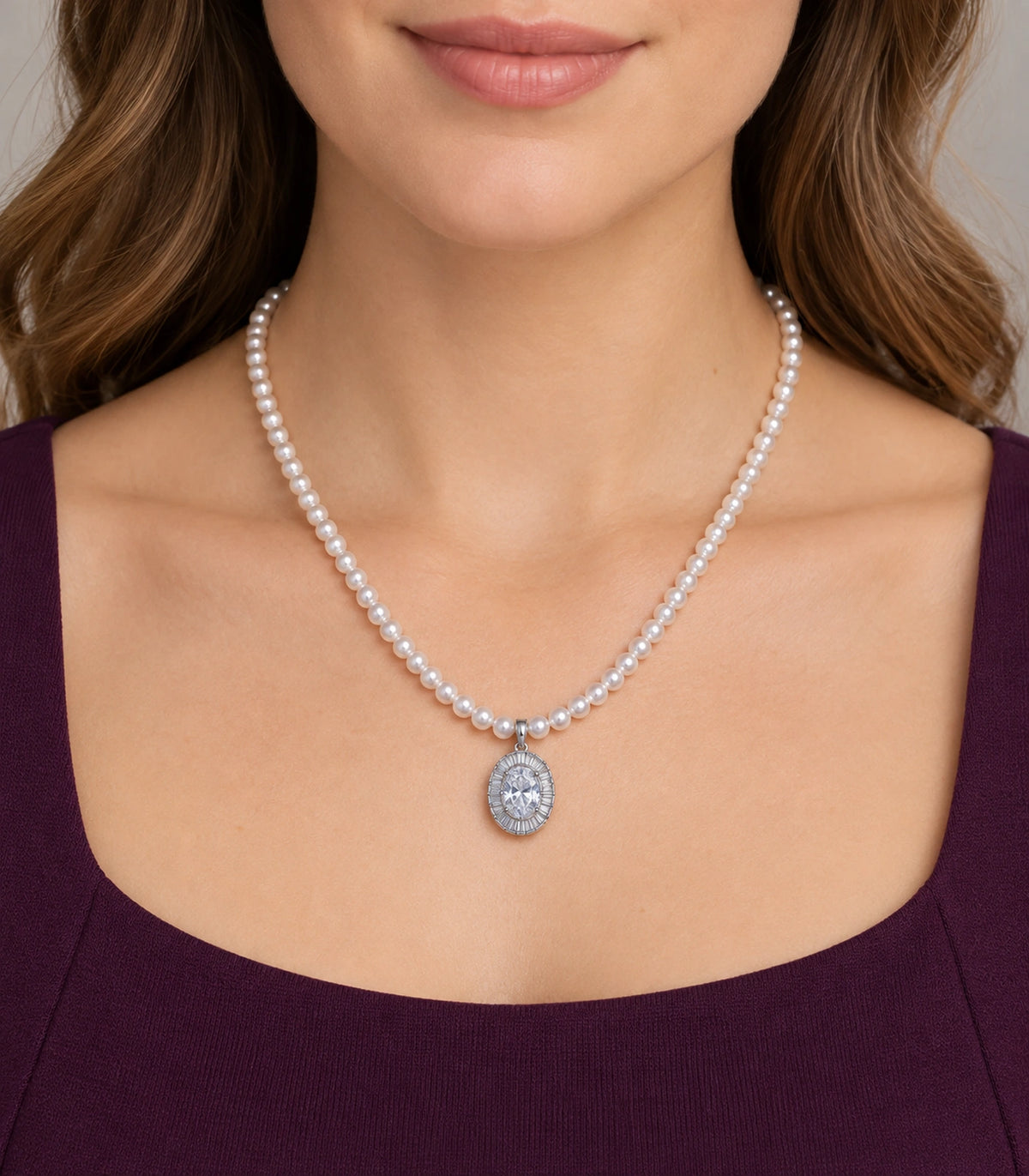 JIMIKI Silver-Tone Oval Baguette Halo Pearl Necklace in Silver-tone / clear / white, worn with a simple outfit