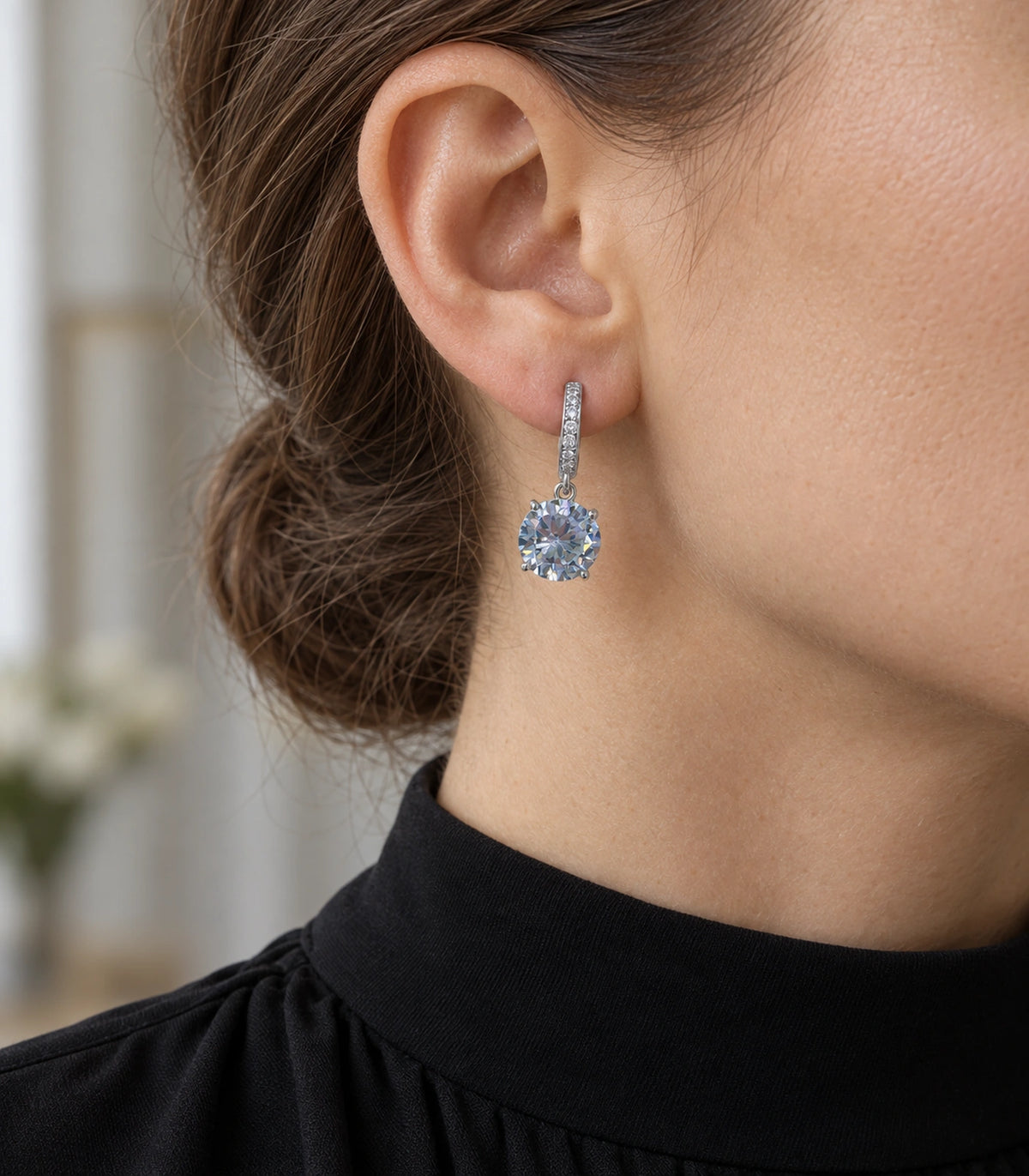 JIMIKI Silver-Tone Oversized Round Solitaire Drop Huggie Earrings in Silver / Clear, editorial model view