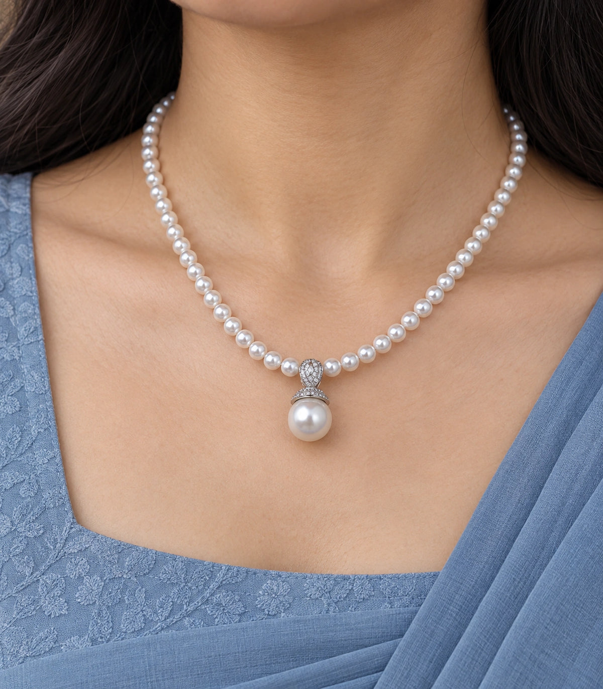 JIMIKI Silver-Tone Pavé Bail Pearl Drop Necklace in Silver-tone / white, close-up of the pendant and pearl-style strand