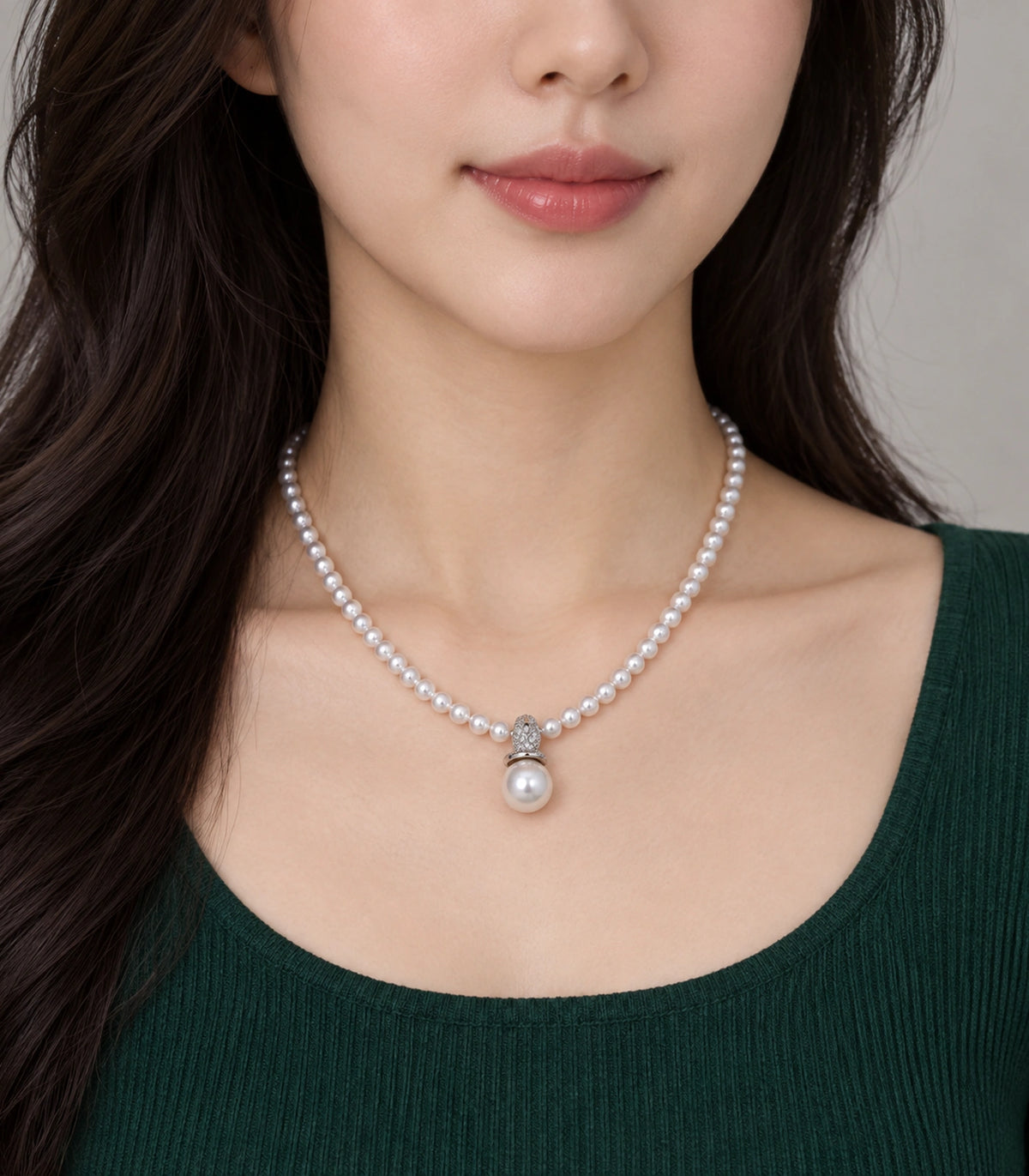 JIMIKI Silver-Tone Pavé Bail Pearl Drop Necklace in Silver-tone / white, worn with a simple outfit