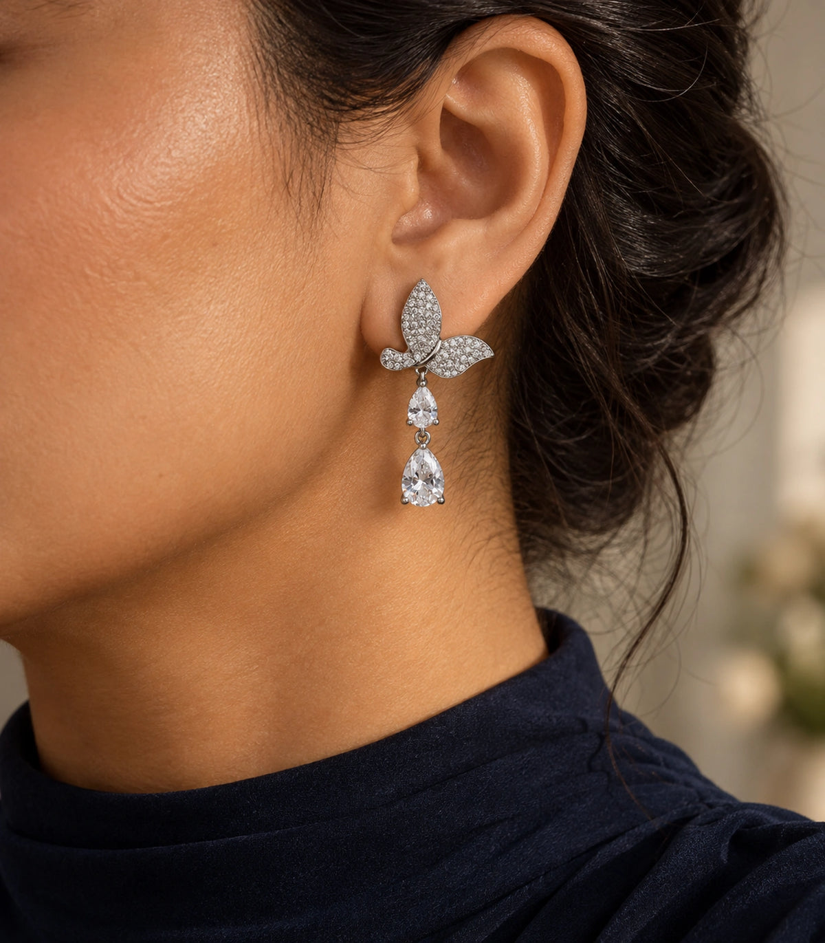 JIMIKI Pave Butterfly Double Teardrop Earring Pair in Silver-tone, editorial model view #color_silver-tone