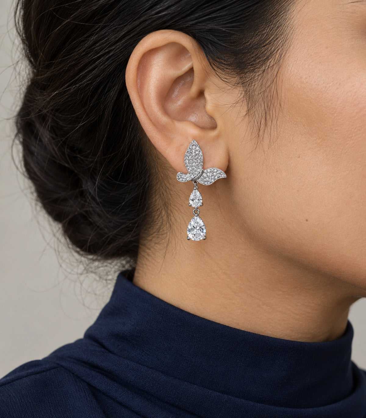 JIMIKI Pave Butterfly Double Teardrop Earring Pair in Silver-tone, model wearing view #color_silver-tone