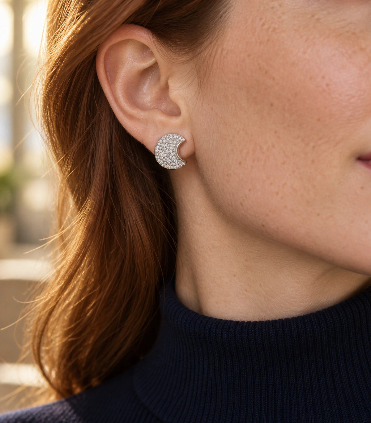 JIMIKI Pave Crescent Moon Stud Earring Pair in Silver-tone, editorial model view #color_silver-tone