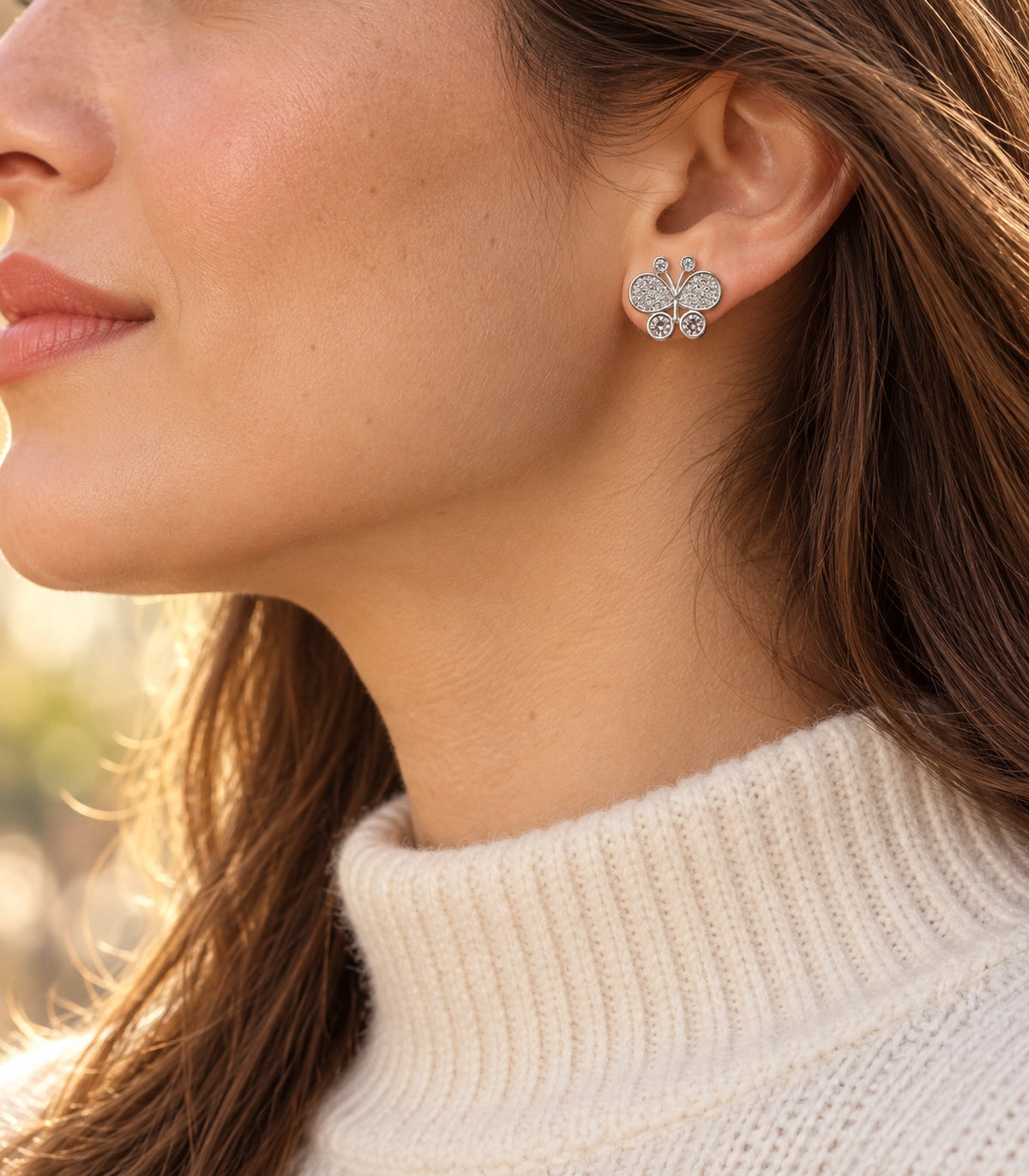 JIMIKI Silver-Tone Pave Crystal Butterfly Stud Earrings in Silver Tone, editorial model view