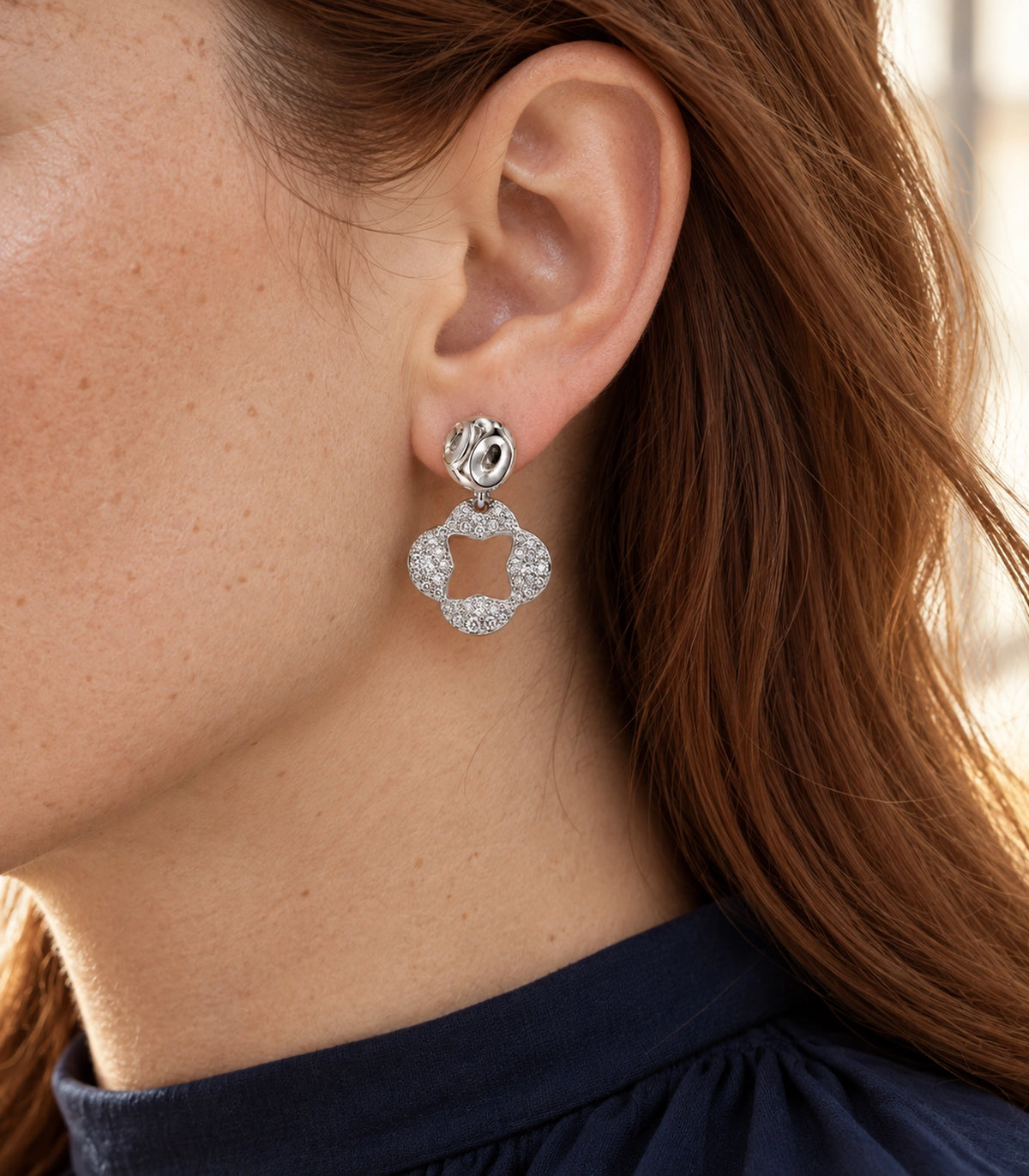 JIMIKI Silver Tone Pave Open Flower Sculpted Stud Drop Earring Pair in Silver tone / clear, editorial model view