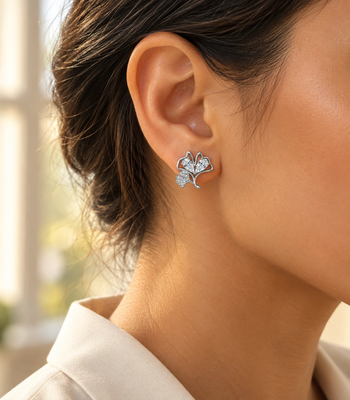 JIMIKI Pear Crystal Open Leaf Stud Earring Pair in Silver Tone, editorial model view #color_silver tone