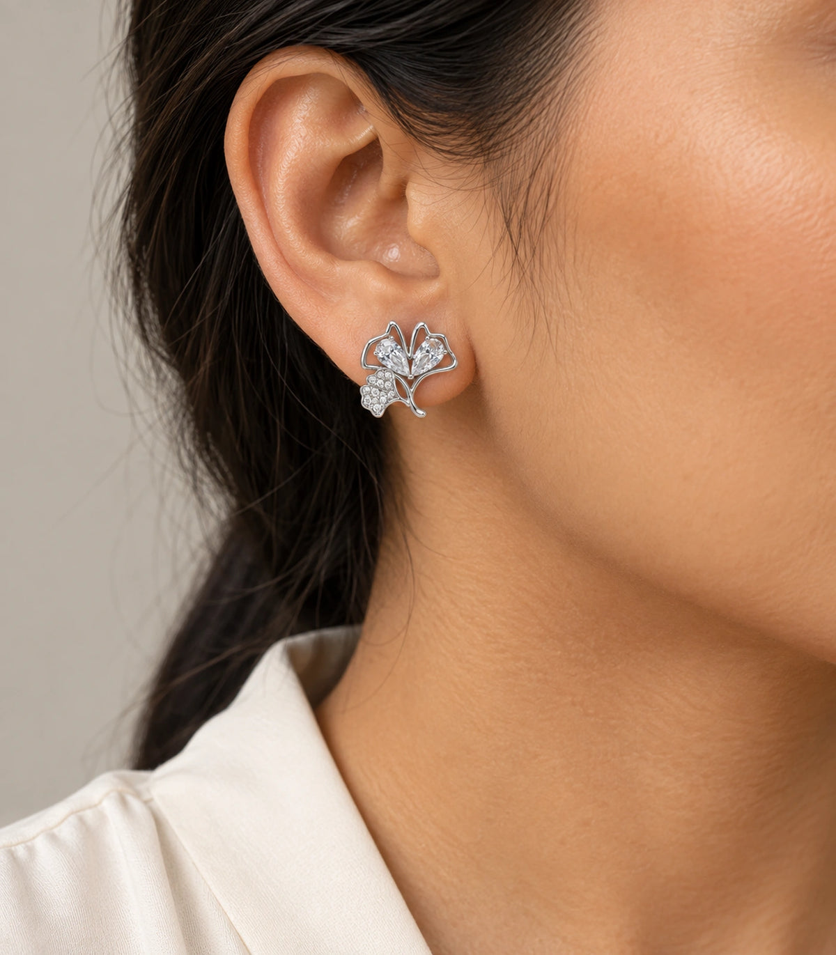 JIMIKI Pear Crystal Open Leaf Stud Earring Pair in Silver Tone, model wearing view #color_silver tone