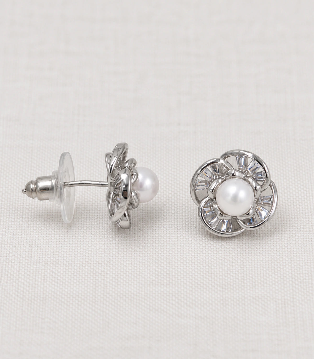 JIMIKI Pearl Centre Crystal Flower Stud Earring Pair in Silver Tone, editorial flat lay #color_silver tone