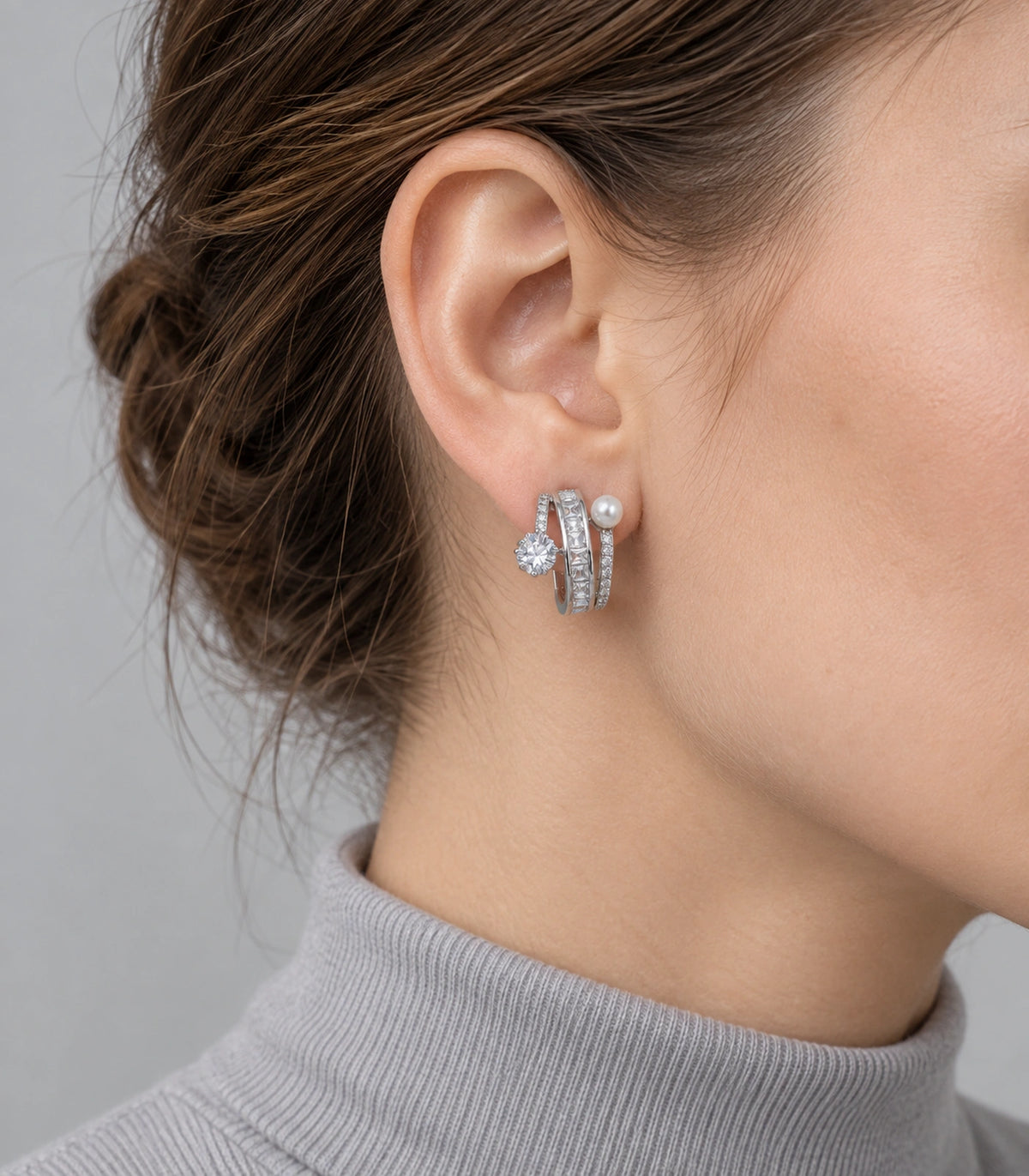 JIMIKI Silver-Tone Pearl Crystal Multi-Row Hoop Earrings in Silver / Clear / White, model wearing view