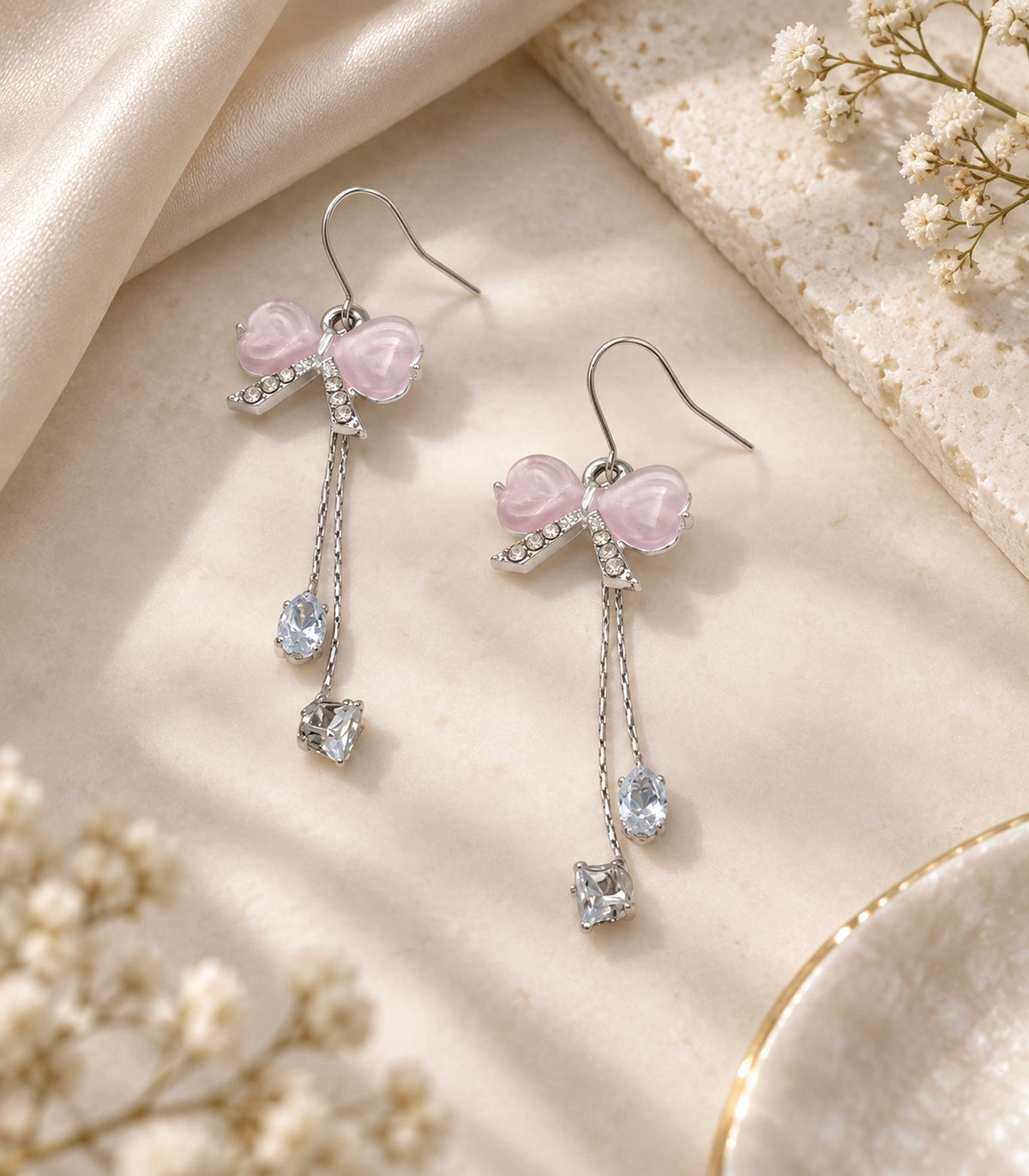 JIMIKI Silver Tone Pink Bow Pear Square Chain Earring Pair in Silver-tone, editorial flat lay