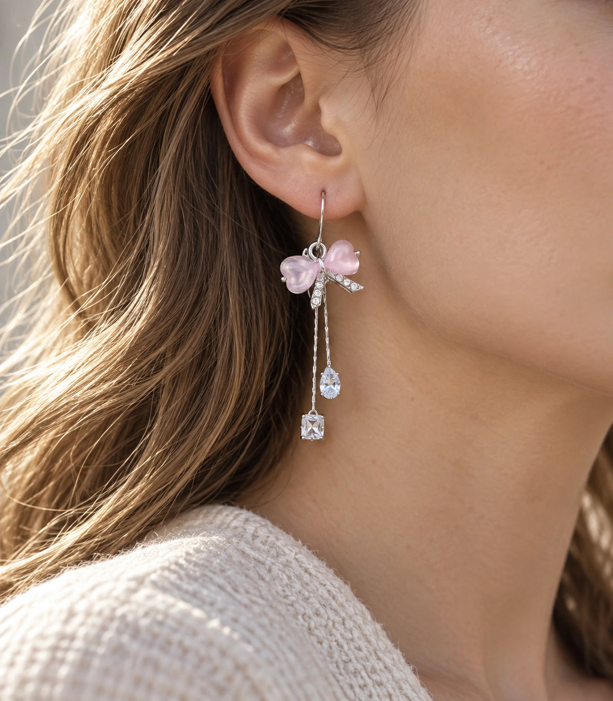 JIMIKI Silver Tone Pink Bow Pear Square Chain Earring Pair in Silver-tone, editorial model view