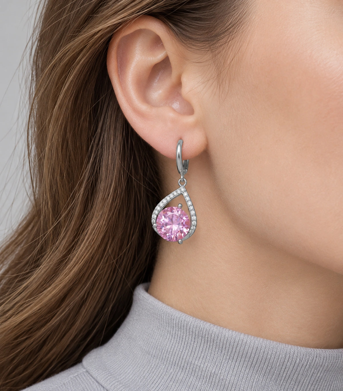 JIMIKI Silver-Tone Pink Crystal Teardrop Huggie Earrings in Silver / Pink, model wearing view