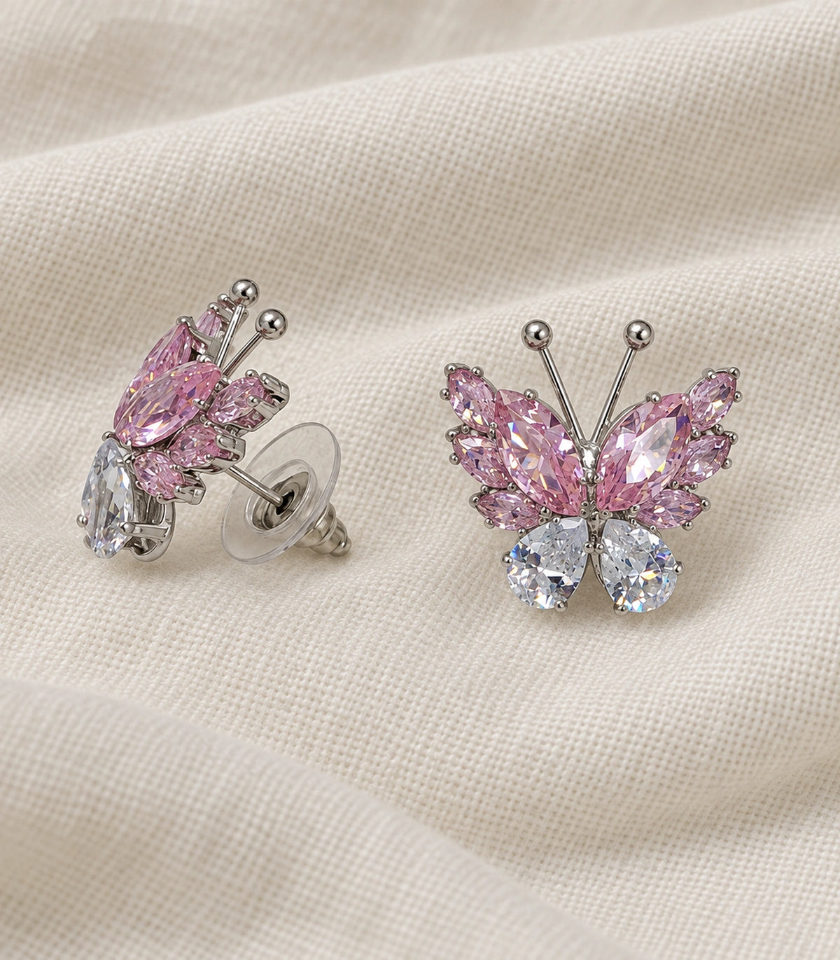 JIMIKI Marquise Teardrop Butterfly Stud Earring Pair in Silver tone / Pink, editorial flat lay #color_silver tone / pink