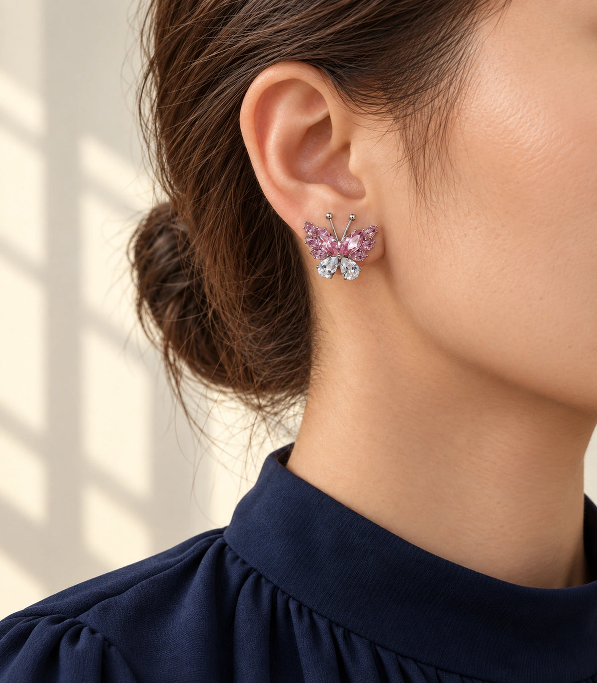 JIMIKI Marquise Teardrop Butterfly Stud Earring Pair in Silver tone / Pink, editorial model view #color_silver tone / pink