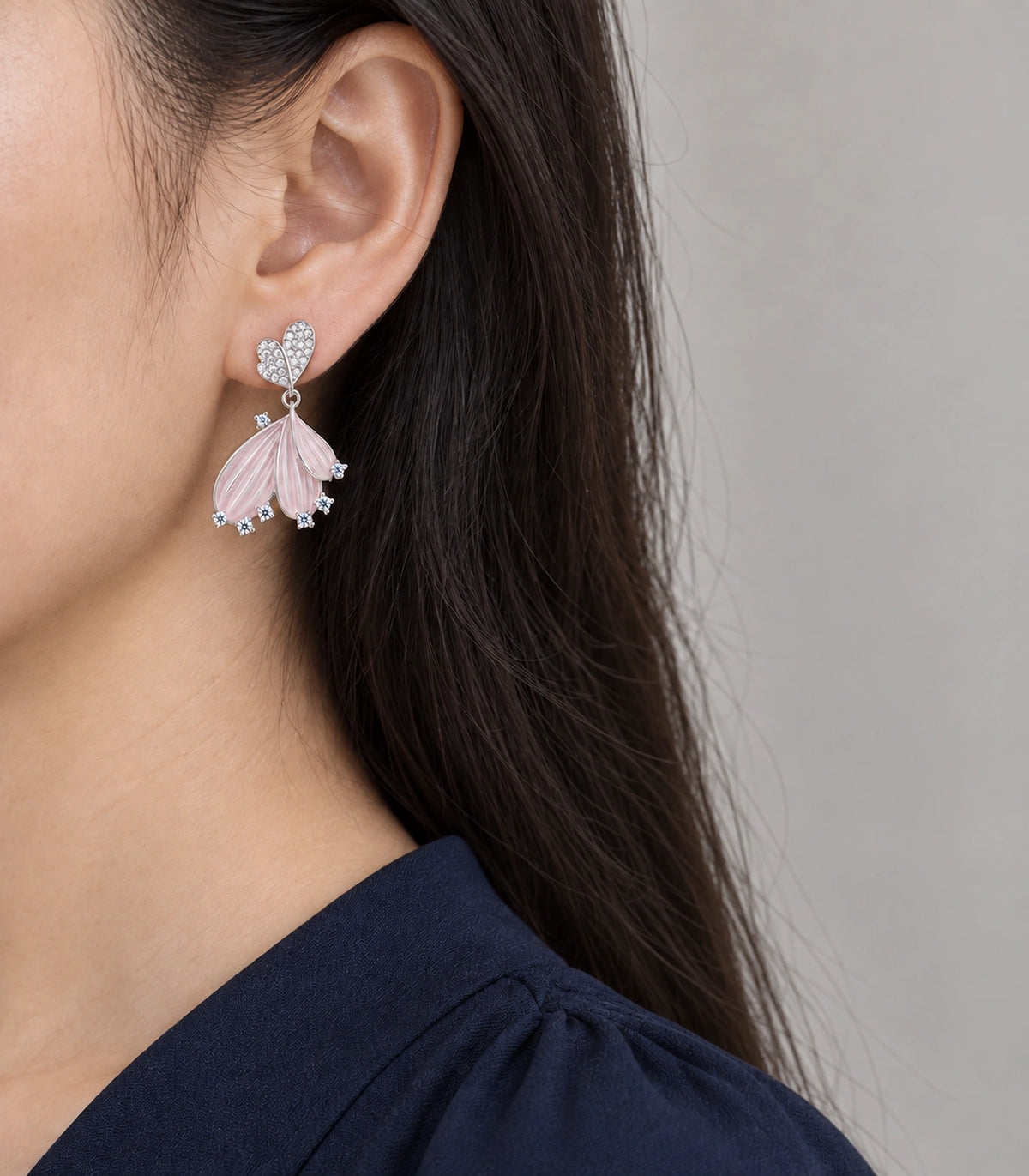 JIMIKI Ribbed Fan Crystal Drop Earring Pair in Silver tone, model wearing view #color_silver tone