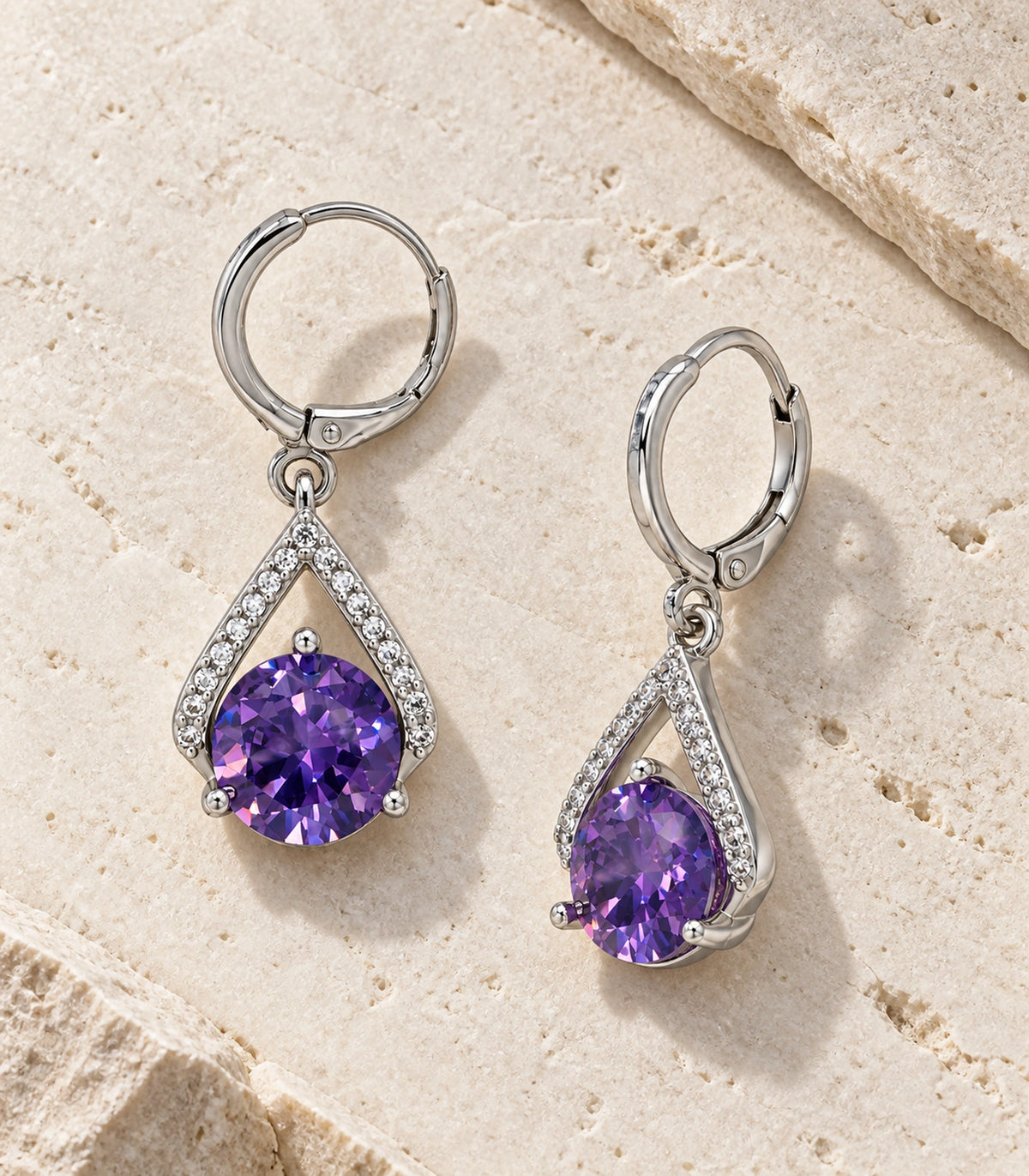 JIMIKI Round Crystal Teardrop Frame Drop Earring Pair in Silver tone/Purple, editorial flat lay #color_silver tone/purple