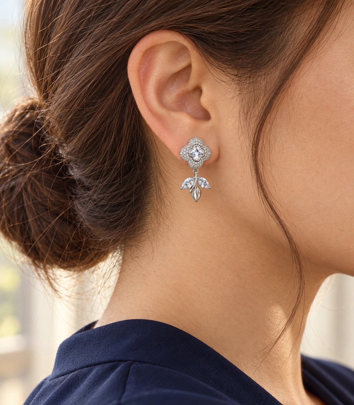 JIMIKI Quatrefoil Crystal Leaf Drop Earring Pair in Silver Tone, editorial model view #color_silver tone