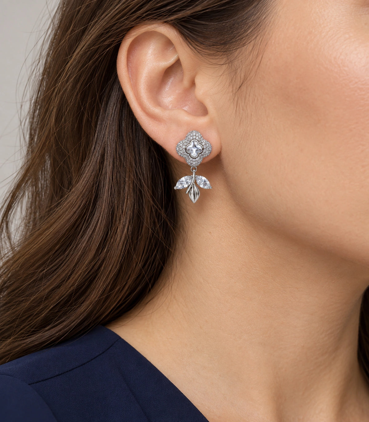 JIMIKI Quatrefoil Crystal Leaf Drop Earring Pair in Silver Tone, model wearing view #color_silver tone