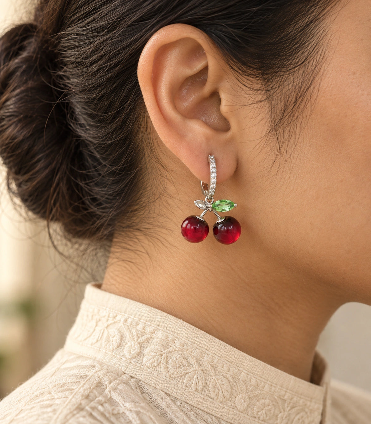 JIMIKI Cherry Crystal Leaf Hoop Earring Pair in Silver-tone / Red / Green, editorial model view #color_silver-tone / red / green