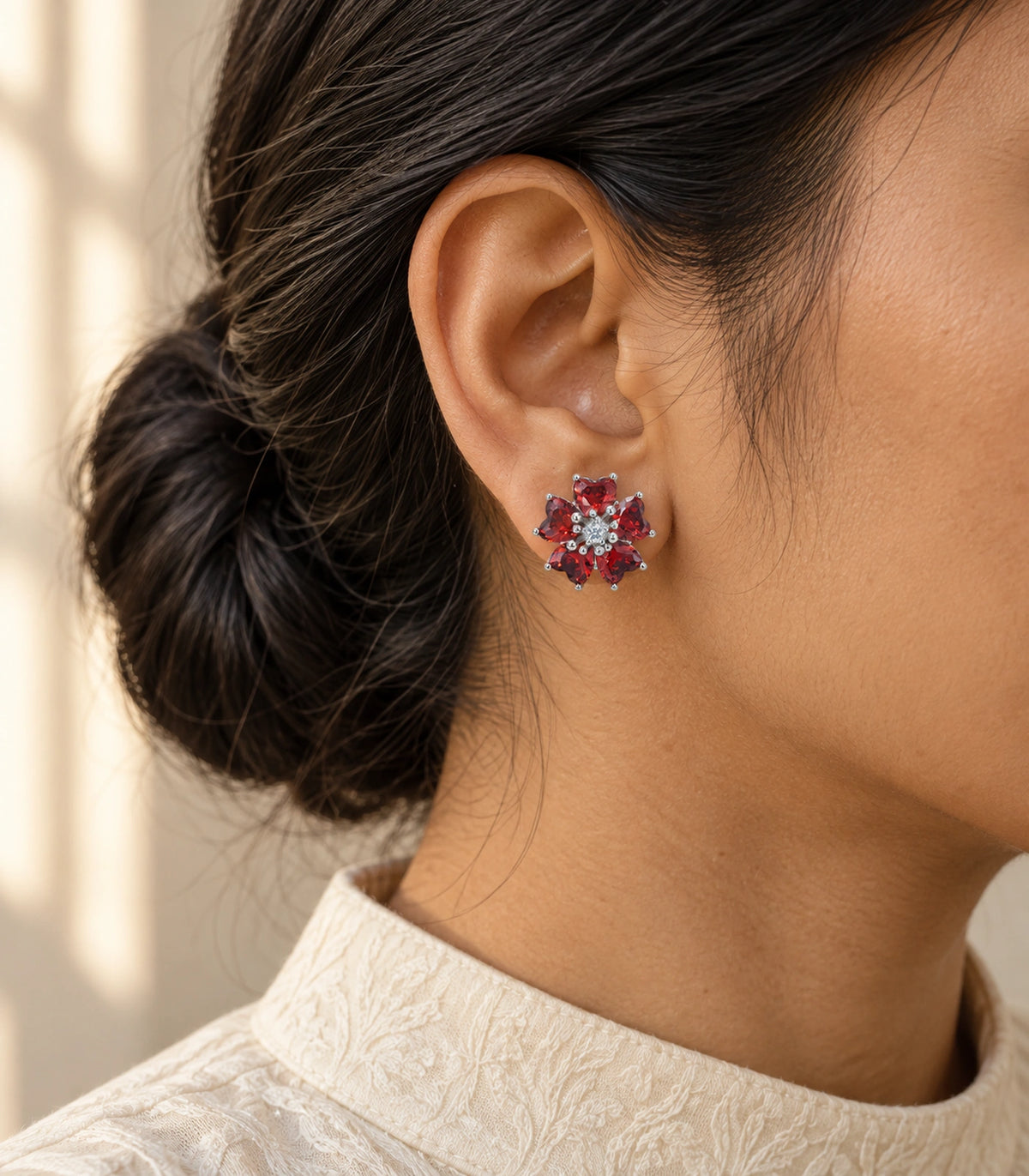JIMIKI Five Petal Crystal Flower Stud Earring Pair in Silver tone / red, editorial model view #color_silver tone / red
