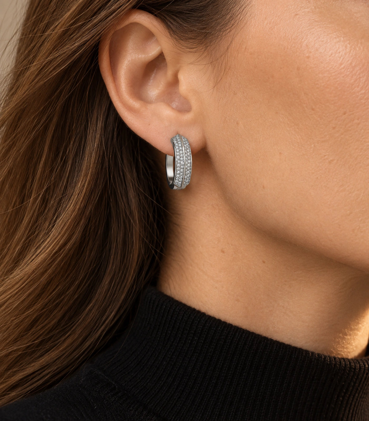 JIMIKI ridged pave hinged hoop earring pair in silver tone, editorial model view #color_silver tone