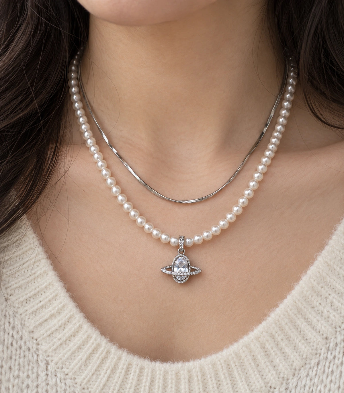 JIMIKI Silver-Tone Saturn Layered Pearl Necklace Set in Silver-tone / clear / white, close-up of the pendant and pearl-style strand