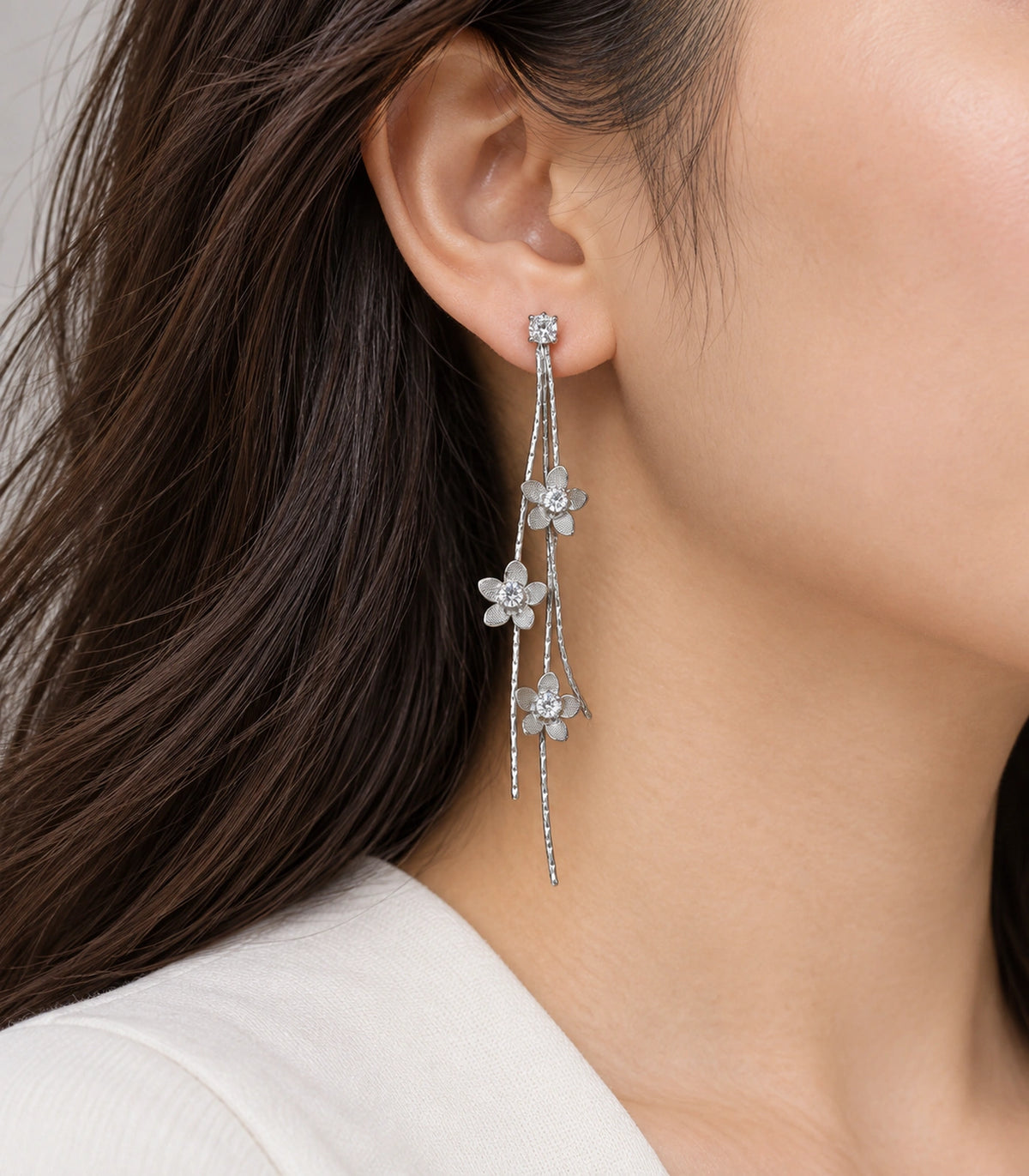 JIMIKI Silver Tone Three Flower Triple Chain Stud Earring Pair in Silver-tone, model wearing view