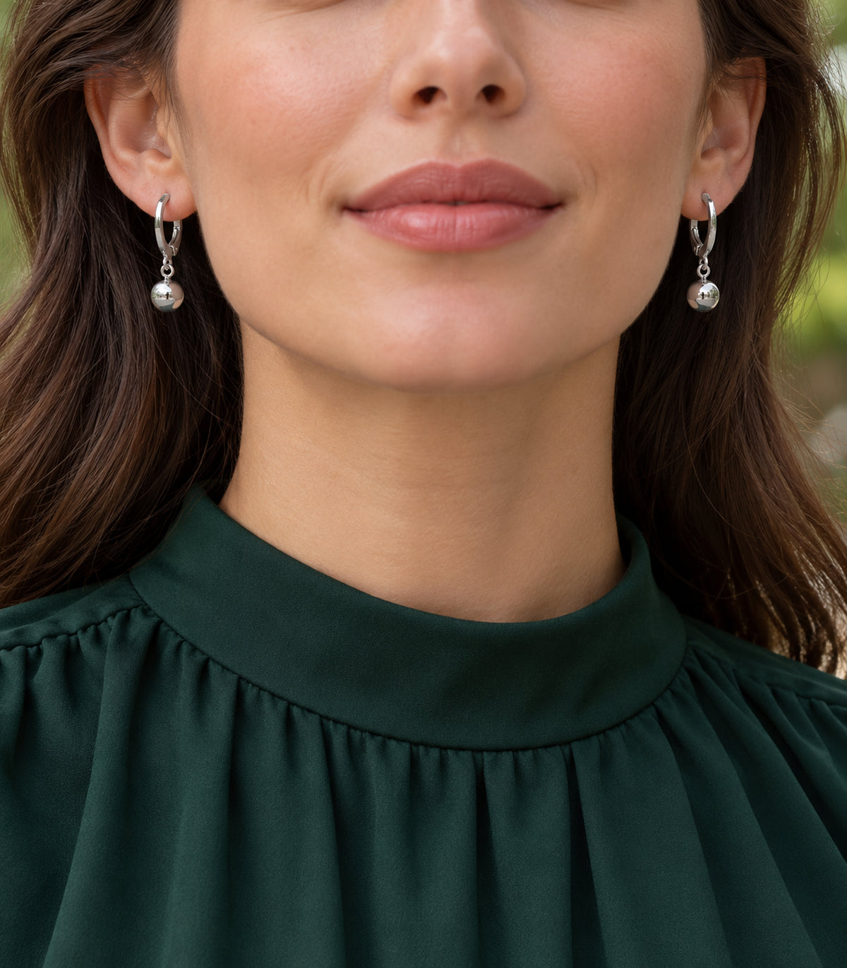 Silver-tone hoop earring set detail — editorial-model