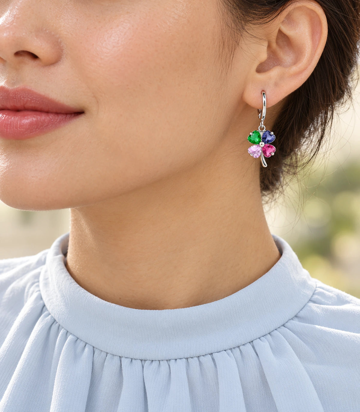 Silver-tone hoop earring set detail — model